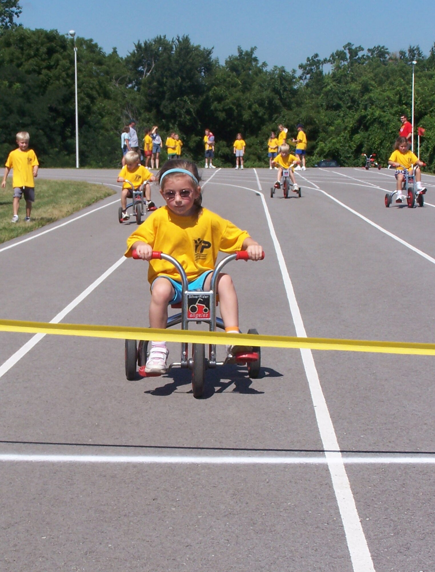 WHITEMAN AIR FORCE BASE, Mo. -- Julia Hale nears the finish line during the inaugural Whiteman Youth Track and Field Meet July 14. There were 47 youth, ranging in ages from 5 to 15-years-old who participated in 14 events. “This is the first year we have held a track and field meet for the youth here,” said Mike Orrison, 509th Services Squadron sports and fitness director. "The event was run by many volunteers from different squadrons on base." The highlight of the meet was the youth versus the parents in a 4-by-110-yard tricycle race, Mr. Orrison said. (Photo printed with permission of Michael Orrison)

