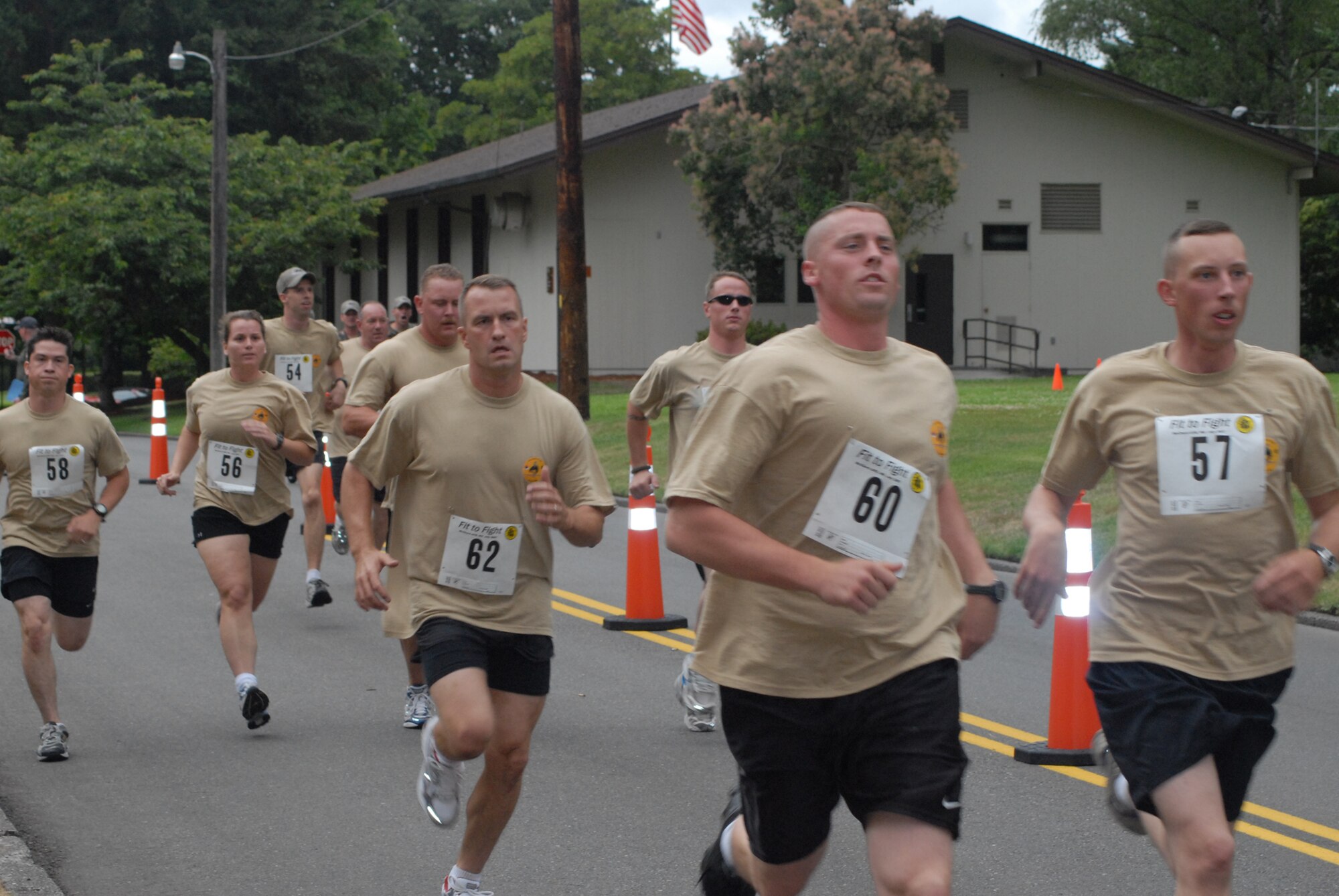 Ten members of the 2007 Pope Rodeo team begin a timed mile and a half run Saturday at McChord Air Force Base, Wash., to participate in a fit-to-fight event. Teams were required to begin the event within three hours of their arrival to McChord. Participants performed their max push ups and sit ups in addition to the run which is all combined into a team score that accounts for two percent of each teams overall Rodeo score. (U.S. Air Force photo/Staff Sgt. Jon Ladue)