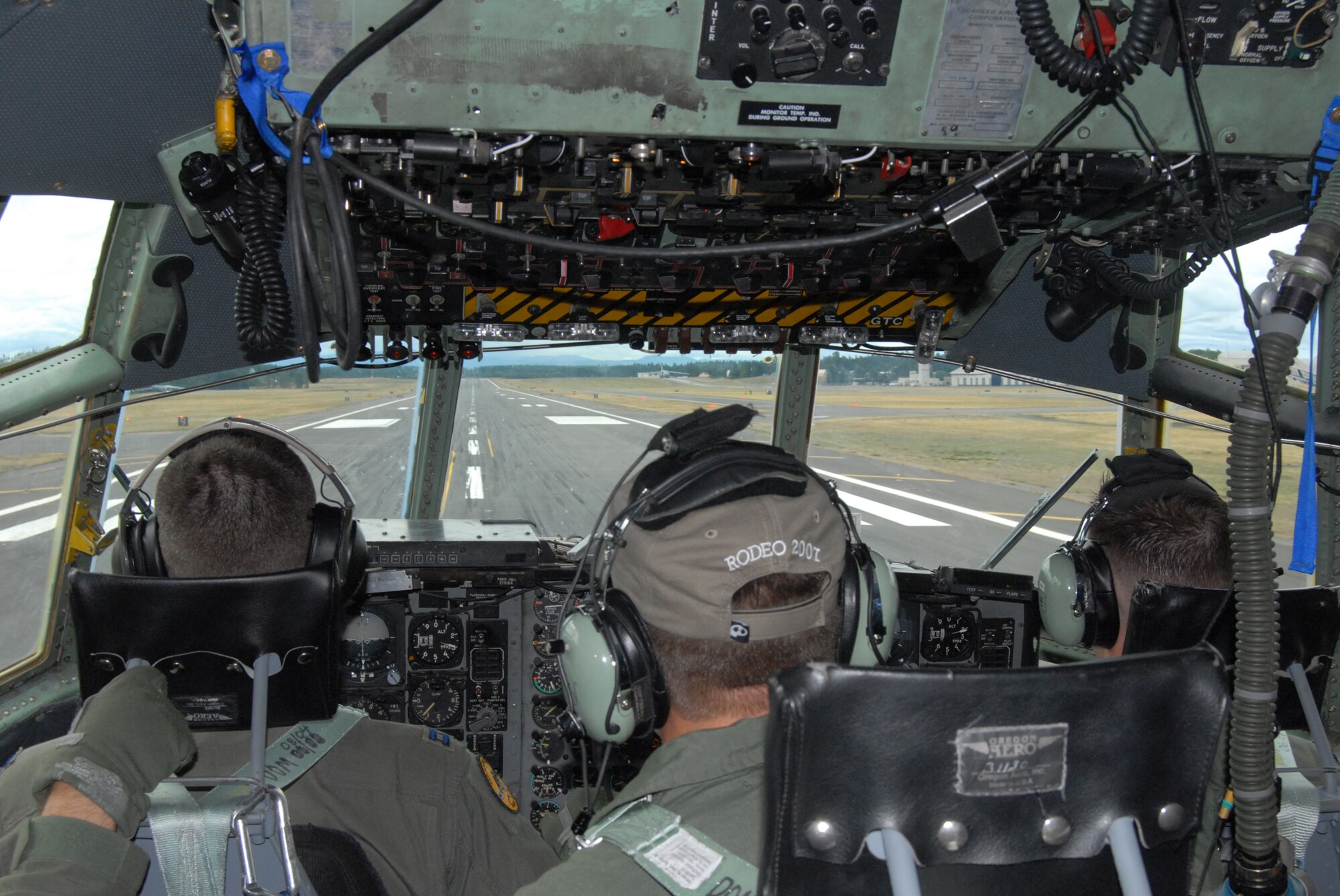 Capt. Nathan Mansfield, pilot, Master Sgt. Ian Leonard, flight engineer and Capt. Adam Asleson, pilot, all members of the Pope aircrew team touch down on the runway Saturday, officialy arriving at McChord Air Force Base, Wash. in what was their first event. The team arrived only four seconds off of their scheduled land time, giving them full points in the very first scored event. (U.S. Air Force photo/Staff Sgt. Jon Ladue)