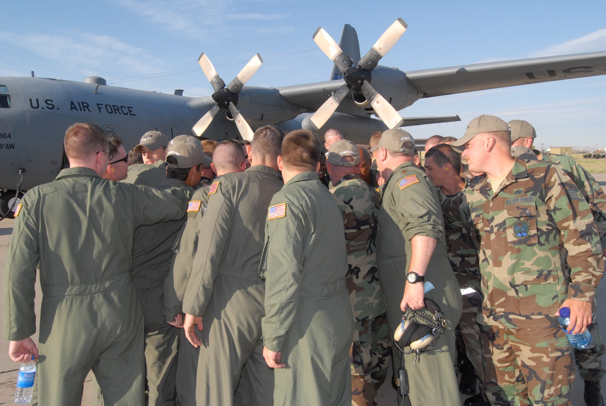 The Pope Rodeo team huddles up at Hill Air Force Base, Utah before making their final leg to McChord Air Force Base, Wash. for the Air Mobility Command international Rodeo competition. The team chanted “Let’s Dance” as the huddle broke to motivate and remind themselves to represent Pope in its last ever AMC Rodeo showing which they refer to as – the last dance. (U.S. Air Force photo/Staff Sgt. Jon Ladue)