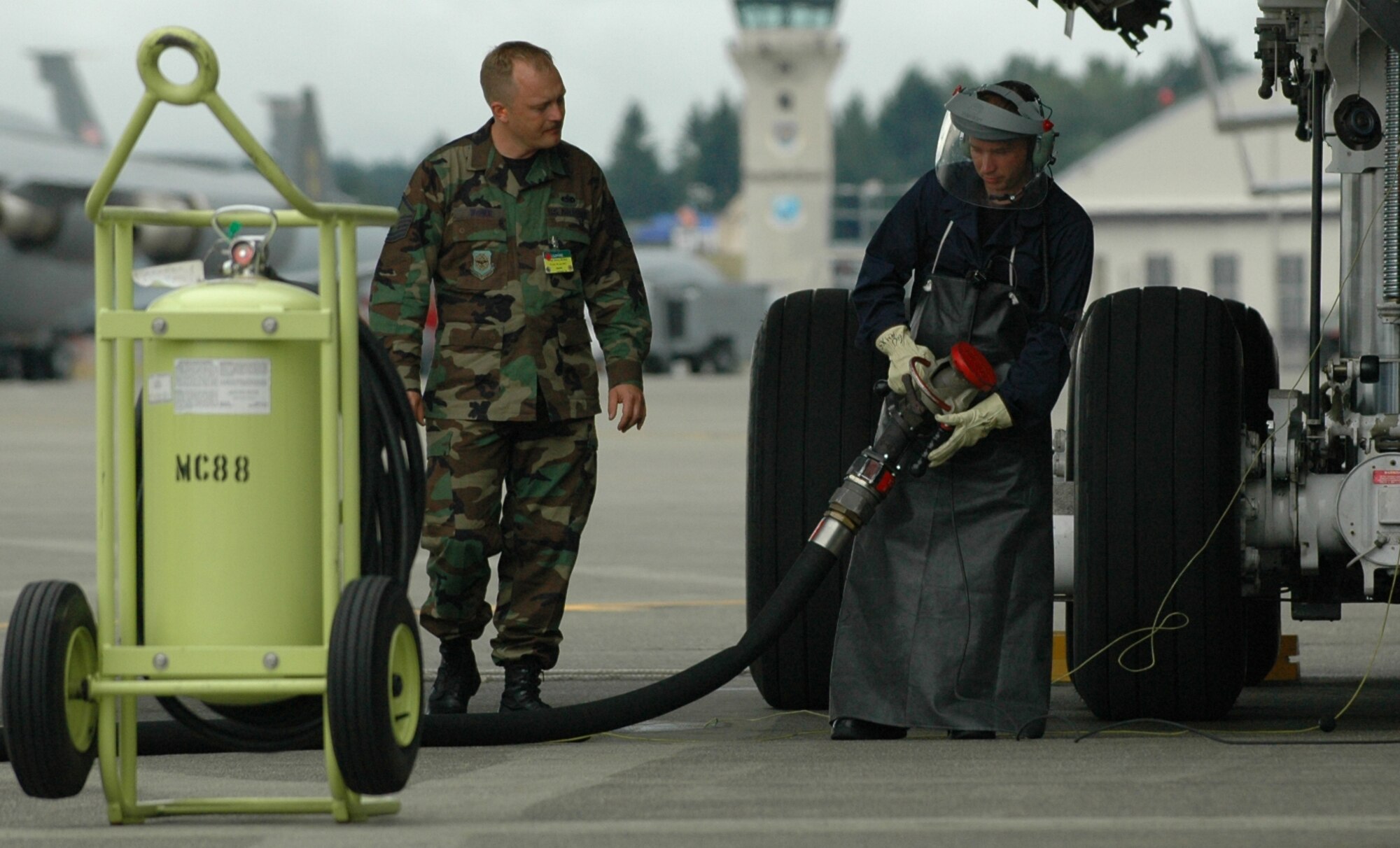 Members of the 60th Aircraft Maintenance Squadron prepare to refuel a C-5 Galaxy during an event at the 2007 Rodeo Competition at McChord Air Force Base, Wash., July 23. Members of the 60th Air Mobility Wing as well as the 615th Contingency Response Wing participated in numerous events to test their flight and ground skills during the Rodeo which runs through July 27. (U.S. Air Force photo/Airman 1st Class Kristen Rohrer)