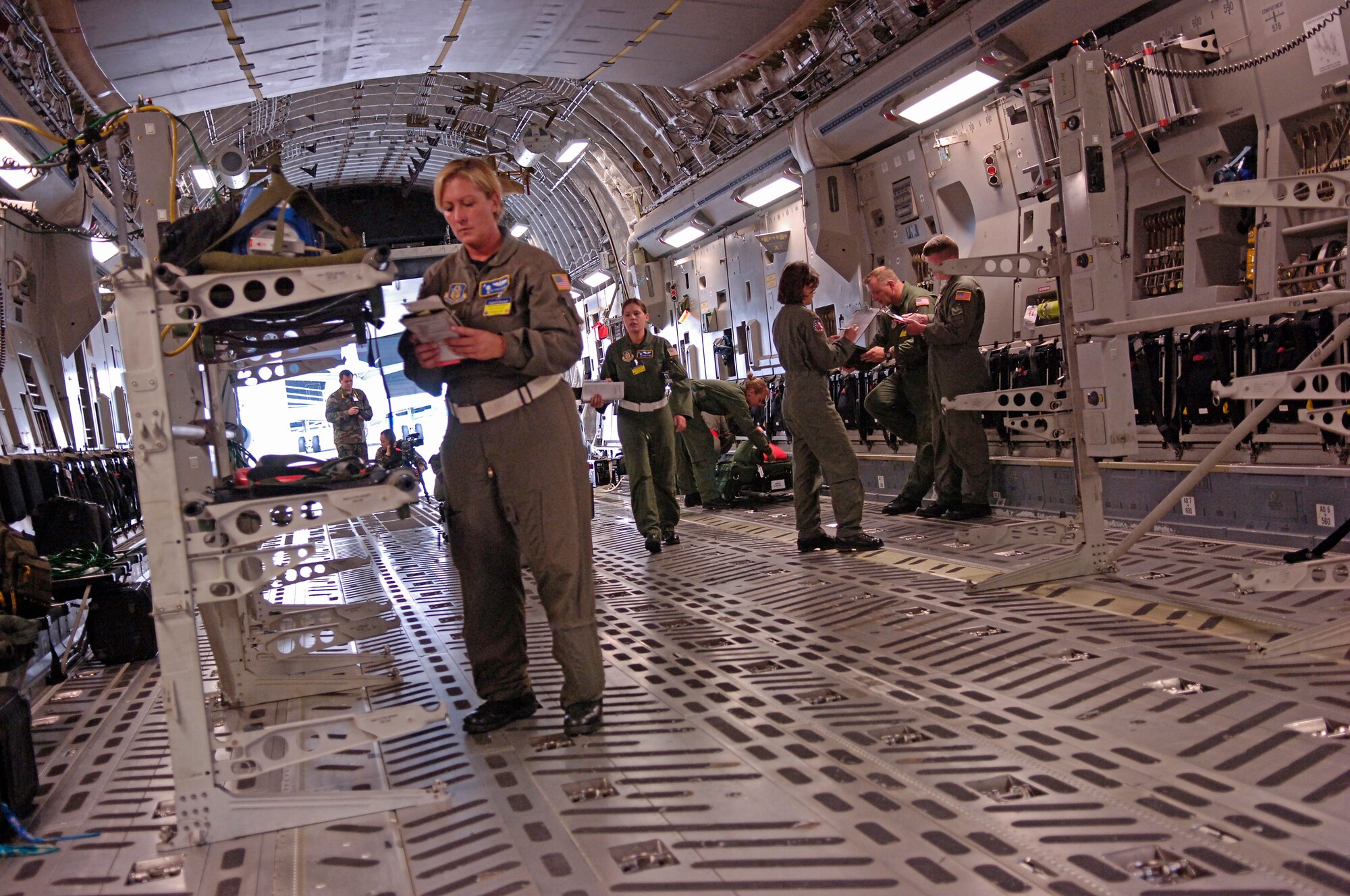 Master Sgt. Vivian Caraviello, 315th Aeromedical Evacuation Squadron, Charleston Air Force Base, S.C., configures a C-17 Globemaster III during an Air Mobility Rodeo 2007 Aeromedical Evacuation scenario, McChord AFB, Wash.  Air Mobility Command's Rodeo 2007 is a readiness competition of U.S. and international mobility air forces.  It focuses on improving warfighting capabilities and support of the Global War on Terrorism.  (U.S. Air Force photo/Tech. Sgt. Maria J. Bare) 