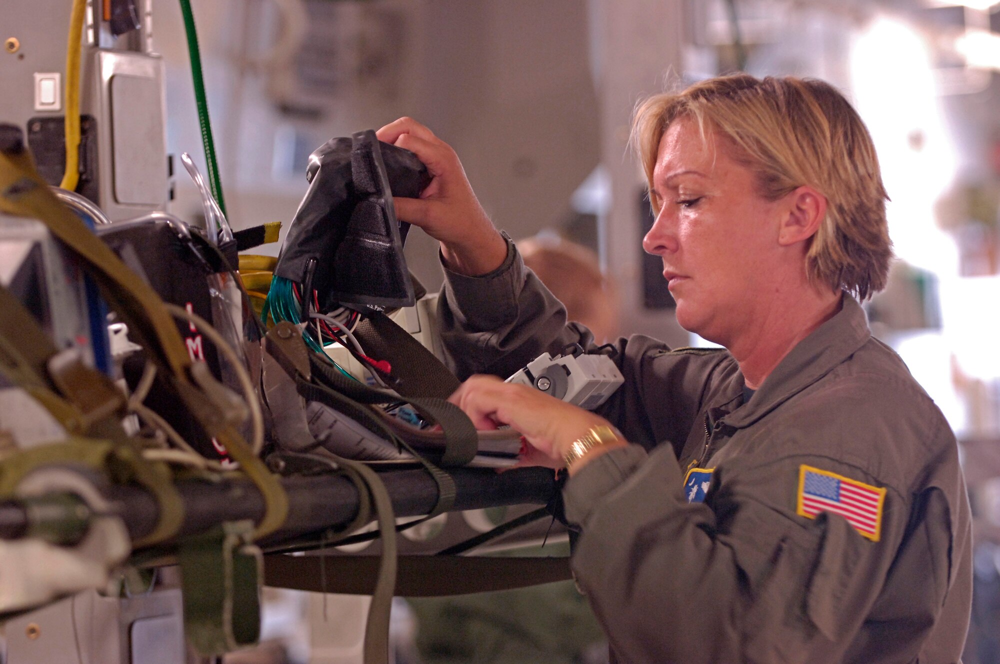 Master Sgt. Vivian Caraviello, 315th Aeromedical Evacuation Squadron, Charleston Air Force Base, S.C., configures a C-17 Globemaster III during an Air Mobility Rodeo 2007 Aeromedical Evacuation scenario, at McChord AFB, Wash., July 23.  Air Mobility Command's Rodeo 2007 is a readiness competition of U.S. and international mobility air forces.  It focuses on improving warfighting capabilities and support of the Global War on Terrorism.  (U.S. Air Force Photo/Tech. Sgt. Maria J. Bare)
