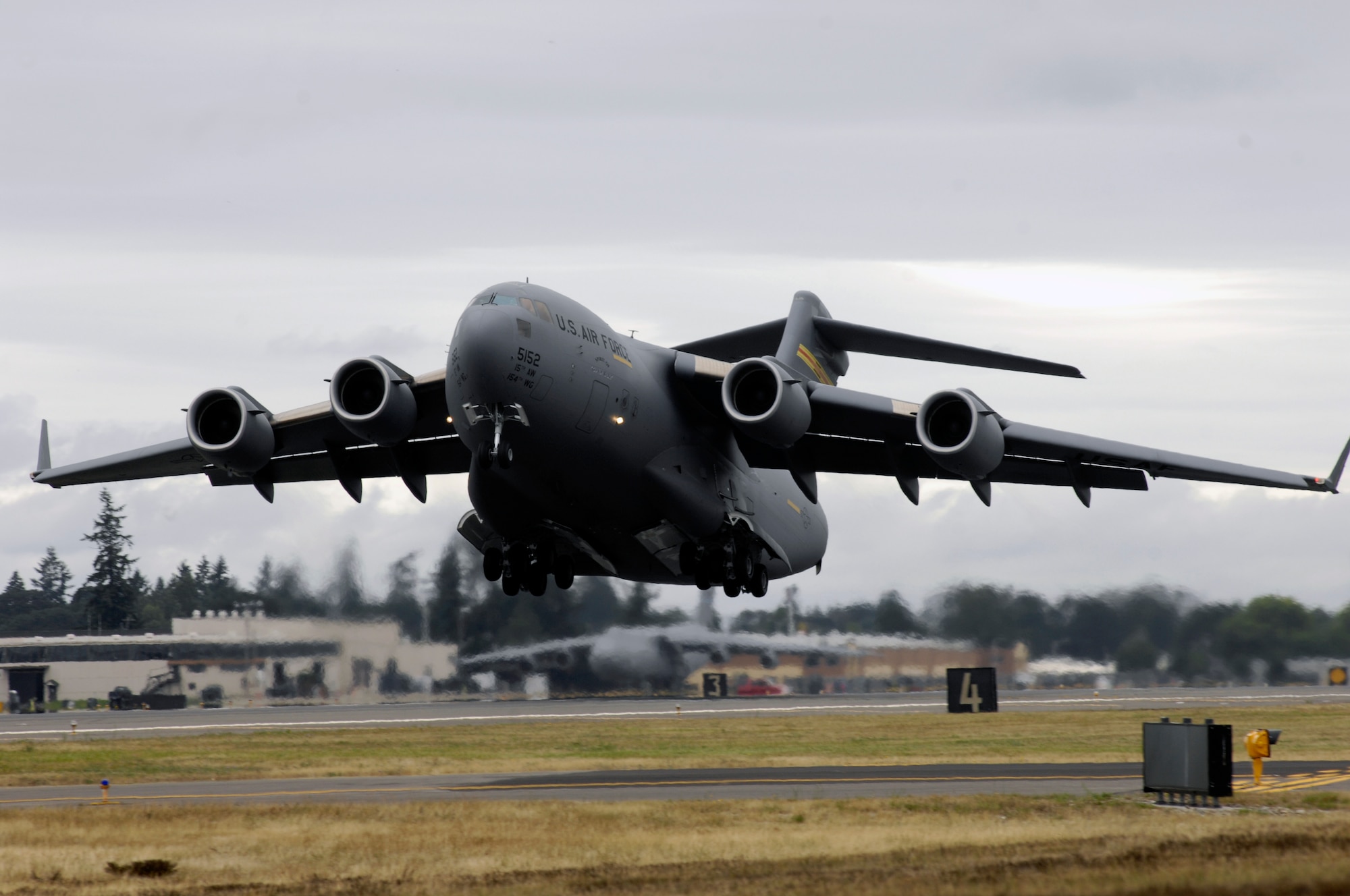 A C-17 Globemaster III takes off while competing at Air Mobility Rodeo 2007, at McChord Air Force Base, Wash., July 23.  Rodeo 2007, hosted by Air Mobility Command, is a readiness competition of U.S. and international air mobility forces.  It focuses on improving warfighting capabilities and support of the Global War on Terrorism. (U.S. Air Force photo/Airman Jonathan Olds) 
