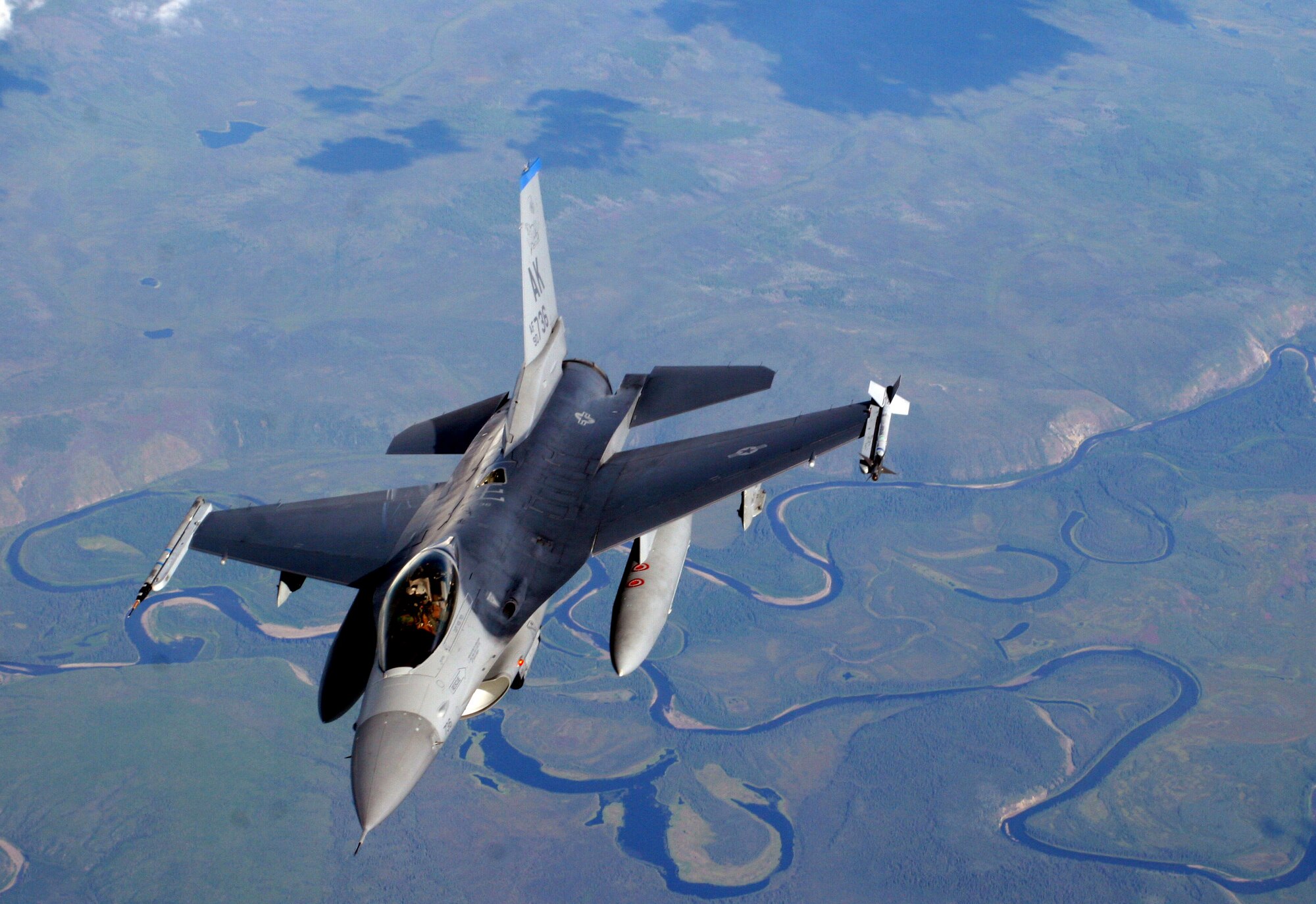 An F-16 Fighting Falcon from the 18th Fighter Squadron at Eielson Air Force Base, Alaska, flies away after refueling from a KC-135 Stratotanker during Red Flag-Alaska July 20. More than 80 aircraft and 1,500 servicemembers from six countries are participating in the exercise July 12 to 27 to sharpen their combat skill in simulated combat sorties. Red Flag-Alaska's multinational participation and the addition of the Pacific Alaskan Range Complex assets provide realistic combat training in a safe and controlled setting. (U.S. Air Force photo/Capt. Tana R.H. Stevenson)