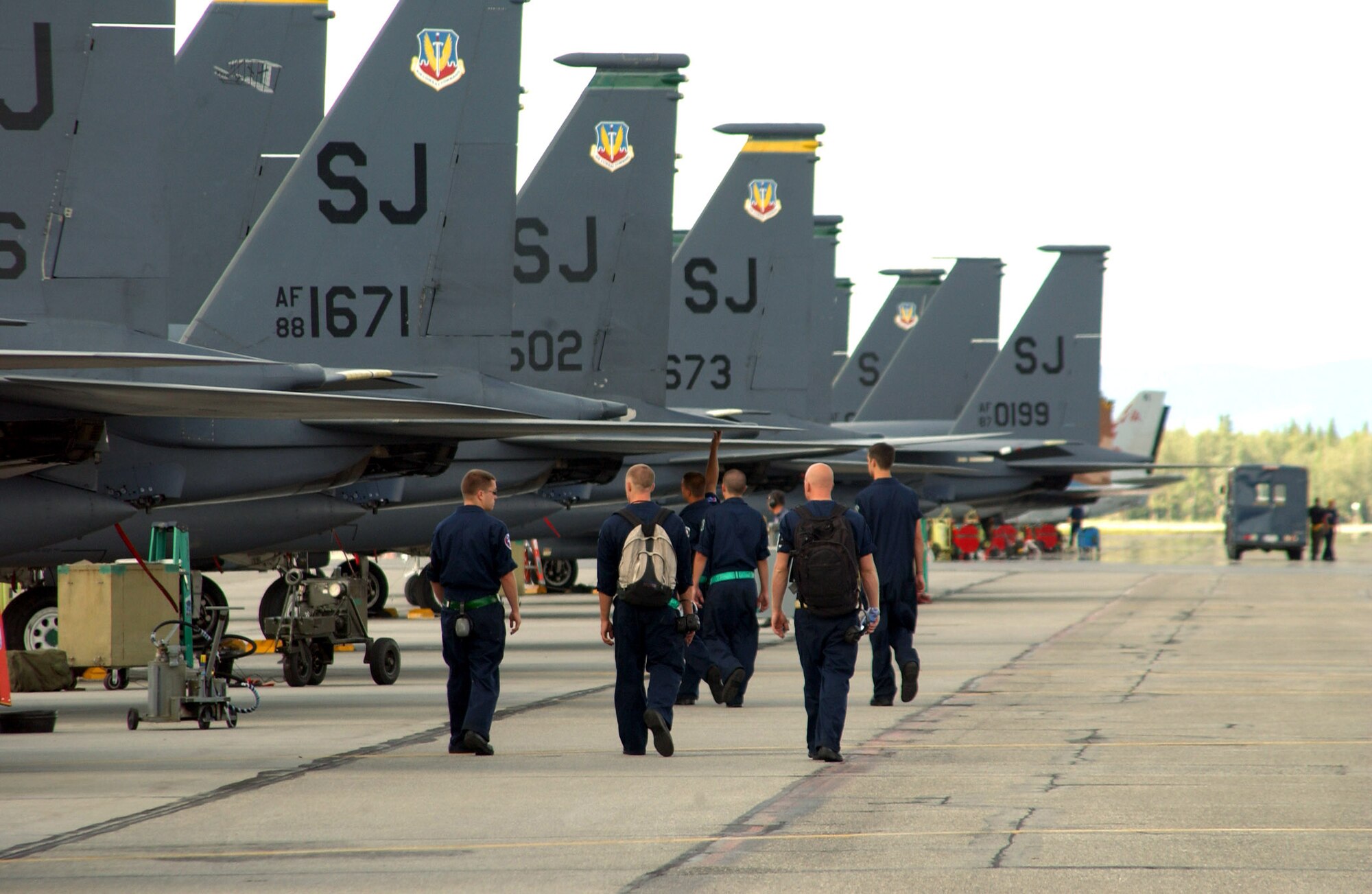 F-15E Strike Eagle maintainers deployed from the 4th Fighter Wing at Seymour Johnson Air Force Base, N.C., head out to their jets before a wave of takeoffs July 19 for Red Flag-Alaska at Eielson AFB, Alaska. Red Flag-Alaska's multinational participation and the addition of the Pacific Alaskan Range Complex assets provide realistic combat training in a safe and controlled setting. (U.S. Air Force photo/Capt. Tana R.H. Stevenson) 
