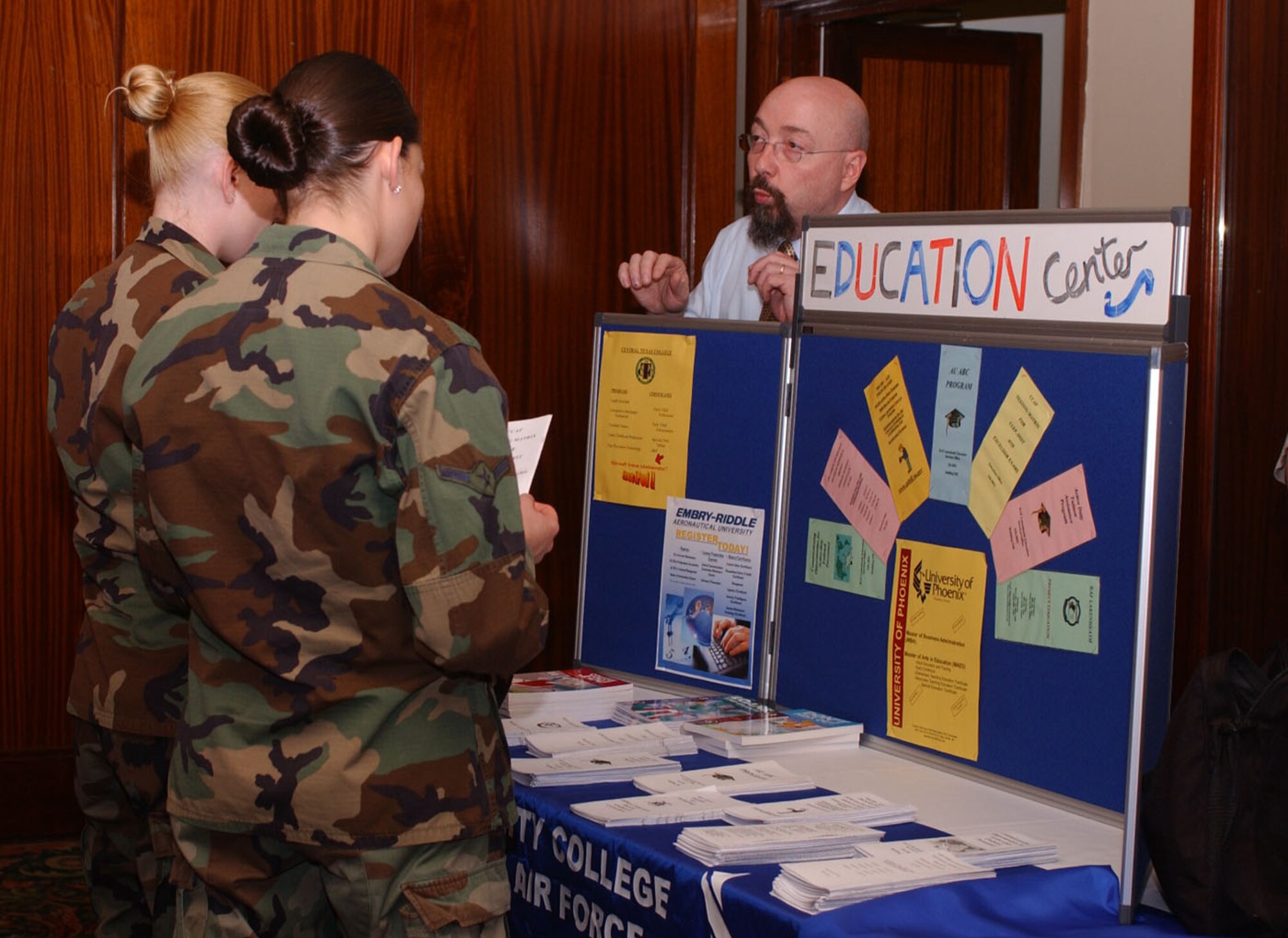 Thomas Langdon, Director of the RAF Lakenheath Education Services center, speaks with Airmen about education opportunities at Eagle's Landing. There are currently 1,049 individuals actively enrolled and taking classes in more than 2,450 classes at RAF Lakenheath. (U.S. Air Force photo by Staff Sgt. Nicholasa Reed)