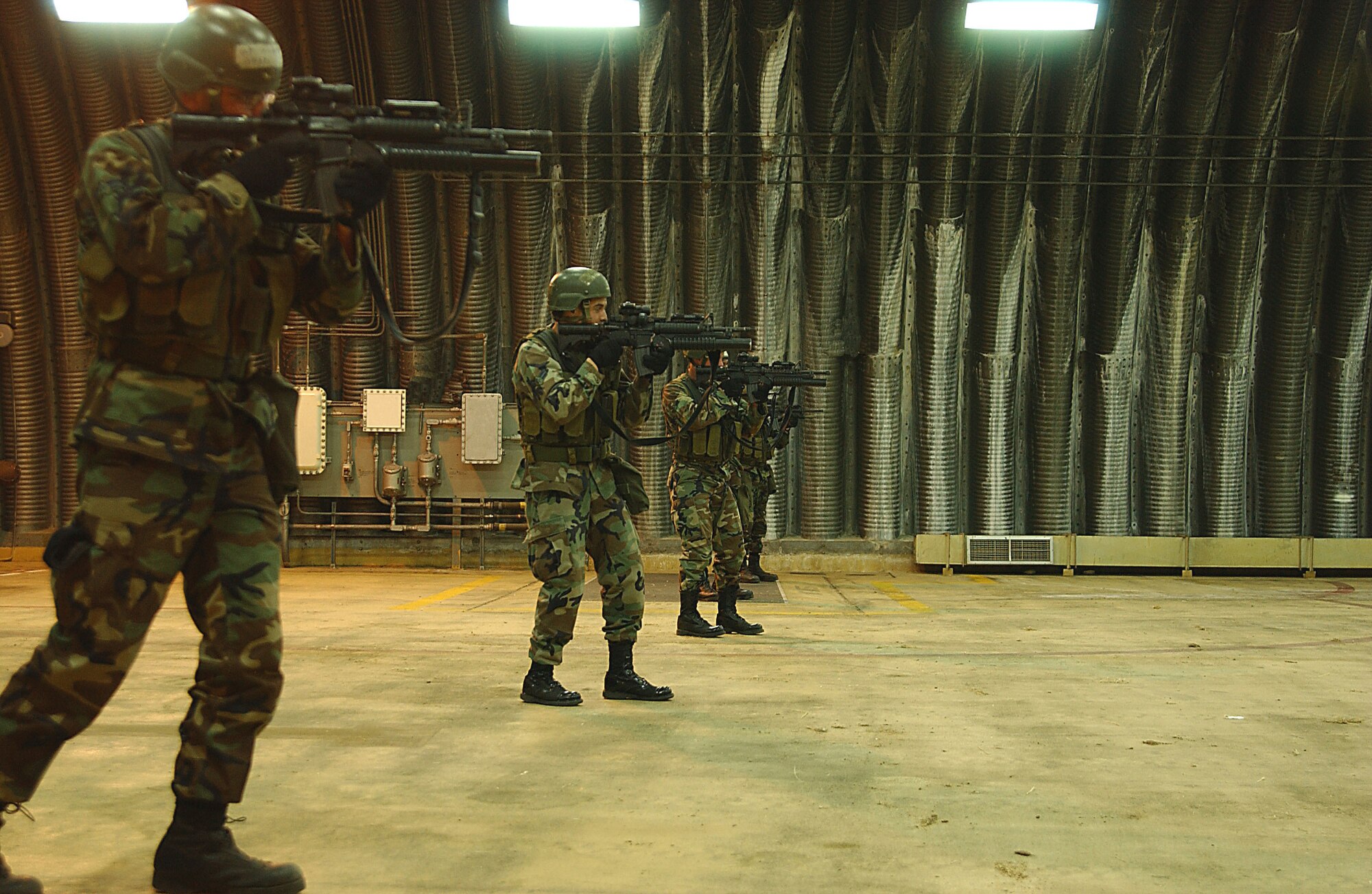 39th Security Forces Squadron Charlie Flight "Cowboys" advance during a recapture exercise of a storage facility on Incirlik Air Base, Turkey. (U. S. Air Force photo by Tech. Sgt. Patrick Hyde)                                 