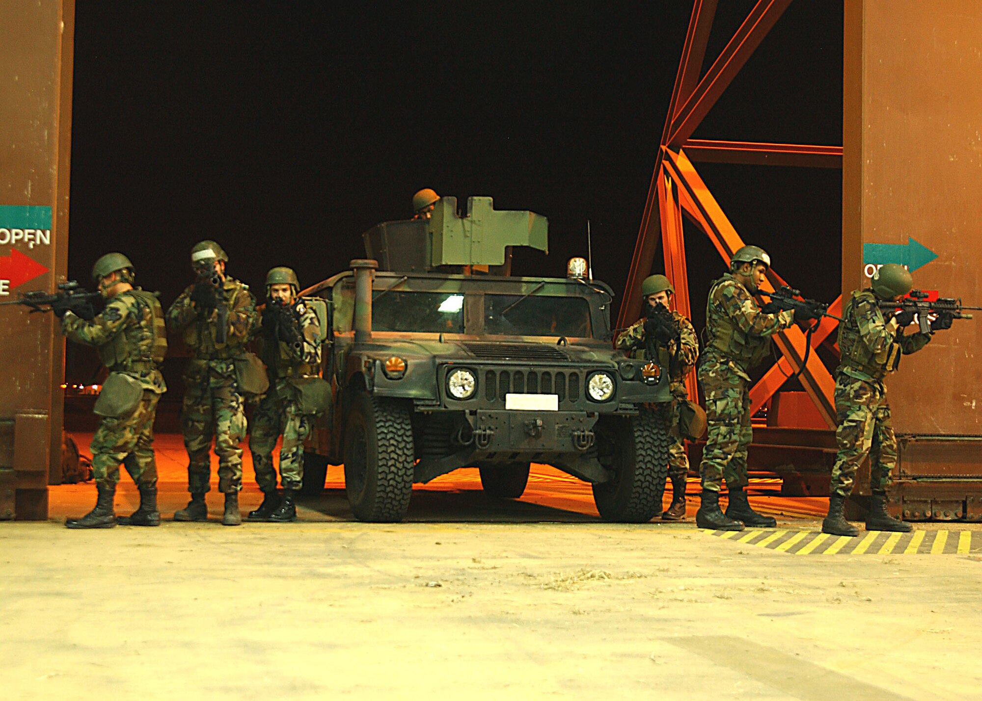 39th Security Forces Squadron Charlie Flight "Cowboys" advance during a recapture exercise of a storage facility on Incirlik Air Base, Turkey. (U. S. Air Force photo by Tech. Sgt. Patrick Hyde)                         