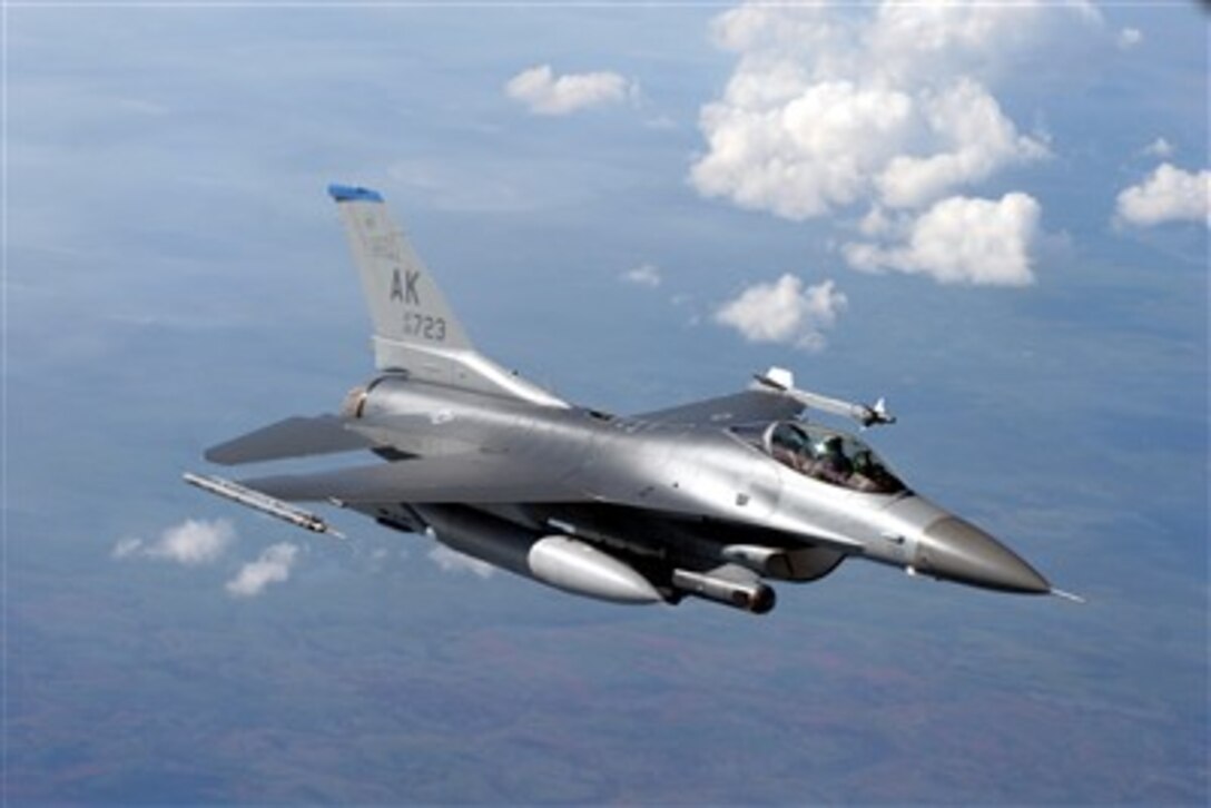 An F-16 Fighting Falcon aircraft from the 18th Fighter Squadron positions itself behind a KC-135 Stratotanker aircraft during exercise Red Flag in Alaska on July 20, 2007.  More than 80 aircraft and 1,500 service members from six different countries are flying together to sharpen their combat skills in simulated combat sorties.  