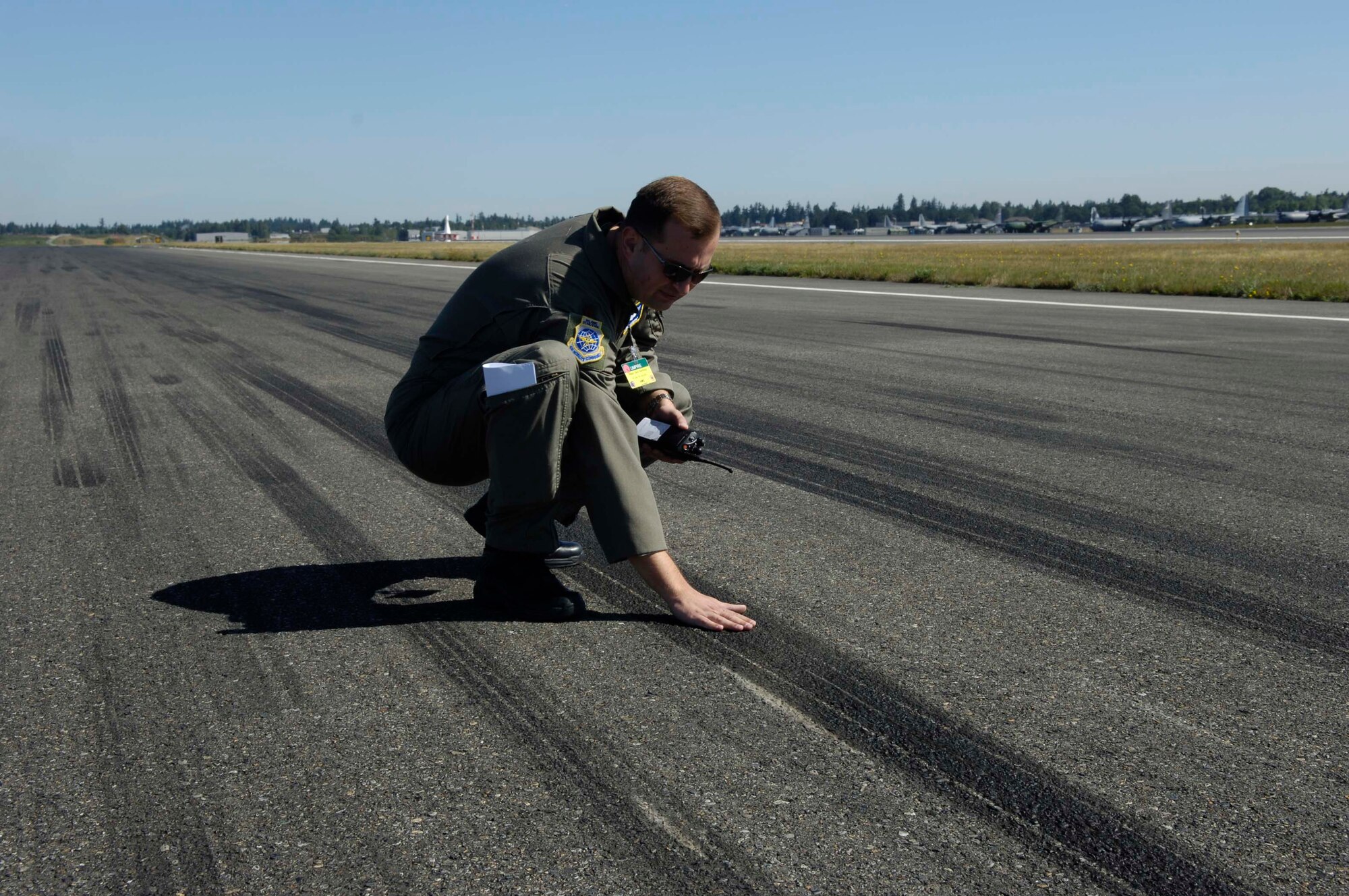 Maj. Jack Rembisz, an umpire from Scott Air Force Base, Ill., finds the landing marks from C-130 Hercules during assault landings at McChord Air Force Base, Wash., July 25.  Air Mobility Rodeo 2007 is a readiness competition of U.S. and international mobility air forces. It focuses on improving war fighting capabilities and support of the Global War on Terrorism.  (U.S. Air Force Photo/Tech. Sgt. Joseph McLean) 