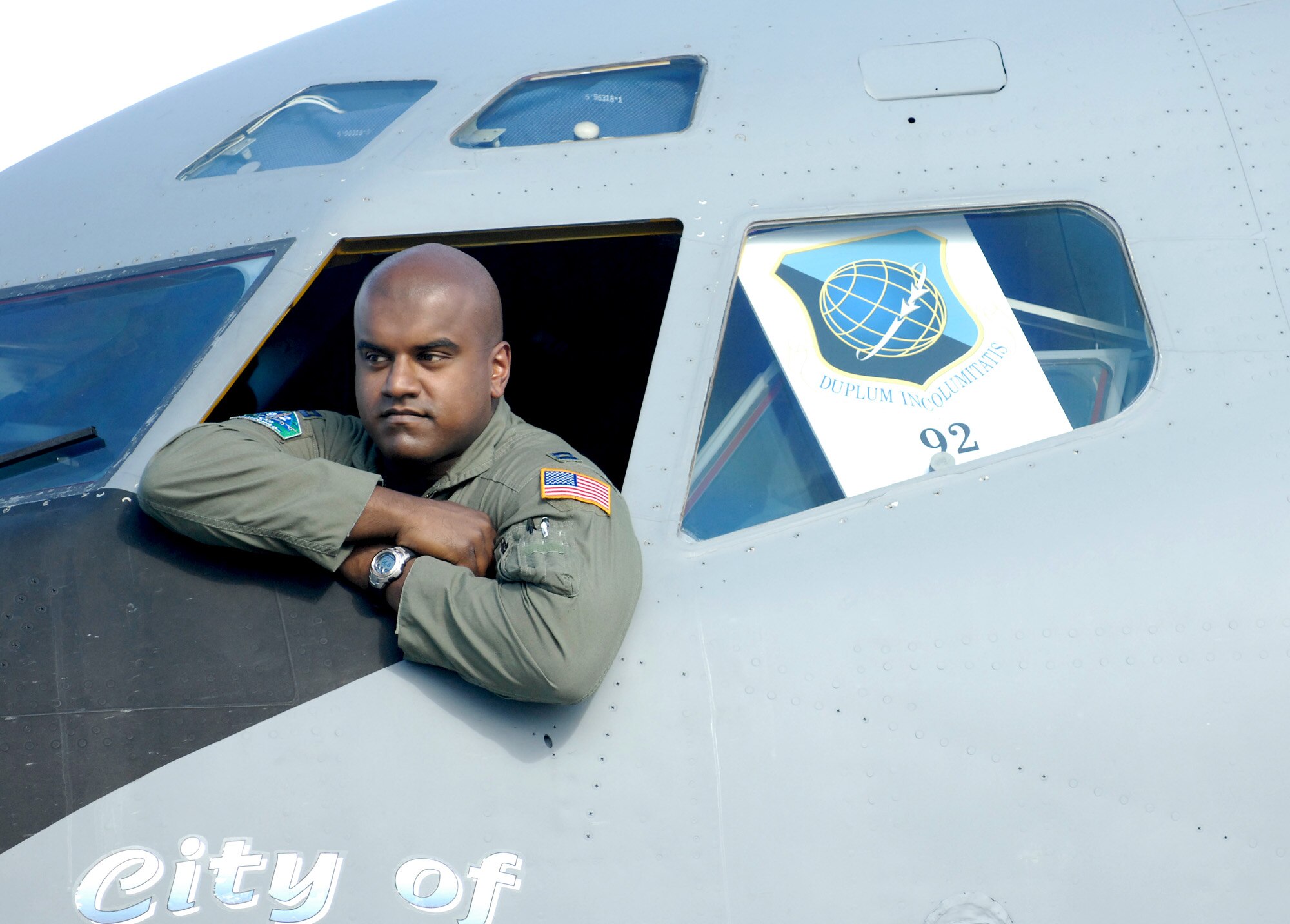 MCCHORD AIR FORCE BASE, Wash. -- U.S. Air Force Capt. Tony Mariapain, 93rd Air Refueling Squadron, Fairchild Air Force Base, Wash., leans out the window of a KC-135 on the flightline here July 21. Rodeo 2007, hosted by Air Mobility Command, is a readiness competition of U.S. and international mobility air forces. It focuses on improving warfighting capabilities and training to support the Global War on Terrorism. (U.S. Air Force photo by Airman First Class Bryan Boyette)