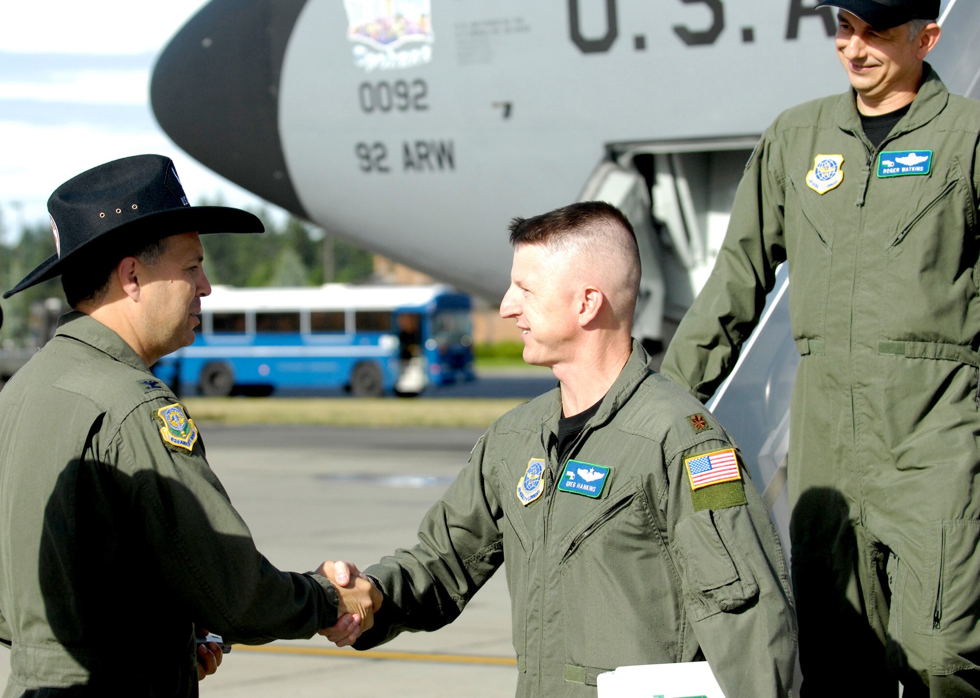 MCCHORD AIR FORCE BASE, Wash. -- U.S. Air Force Col. Jerry Martinez, commander of the 62nd Airlift Wing here, greets Maj. Greg Hankins of the 92nd Air Refueling Wing, Fairchild Air Force Base, Wash., to the Rodeo 2007 competition on the flight line July 21. Rodeo 2007, hosted by Air Mobility Command, is a readiness competition of U.S. and international mobility forces. It focuses on improving warfighting capabilities and training to support the Global War on Terrorism. (U.S. Air Force photo by Airman First Class Bryan Boyette)