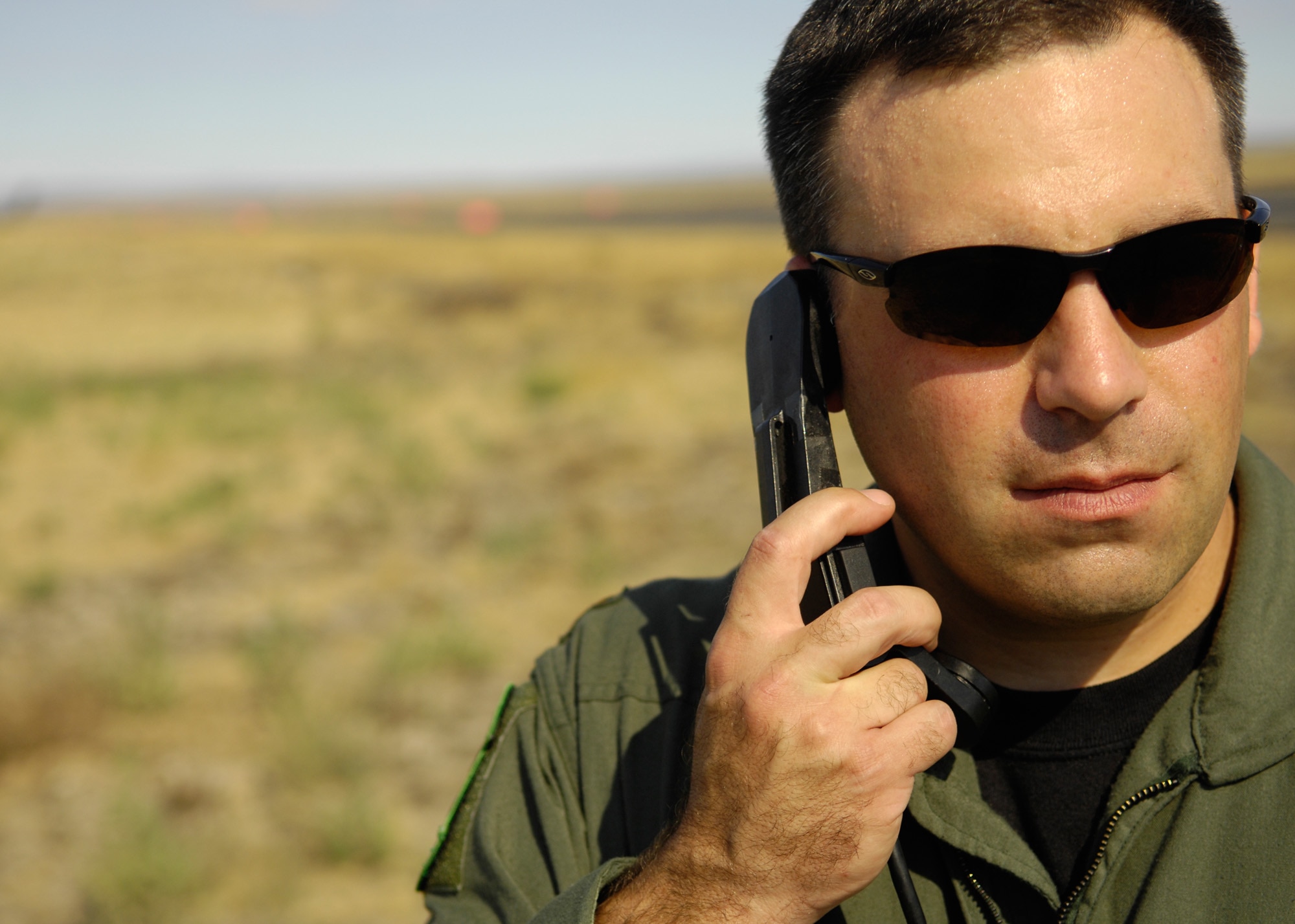 MCCHORD AIR FORCE BASE, Wash. -- U.S Air Force Maj. Daniel Arch, 92nd Air Wing, Fairchild Air Force Base, Wash., communicates with the control tower while working as an umpire during a. Air Mobility Rodeo 2007 event at Grant International Airport, Moses Lake, Wash., July 23. Rodeo 2007, hosted by Air Mobility Command, is a readiness competition of U.S. and international mobility forces. It focuses on improving warfighting capabilities and training to support the Global War on Terrorism. (U.S. Air Force photo by Tech. Sgt. John M. Foster)