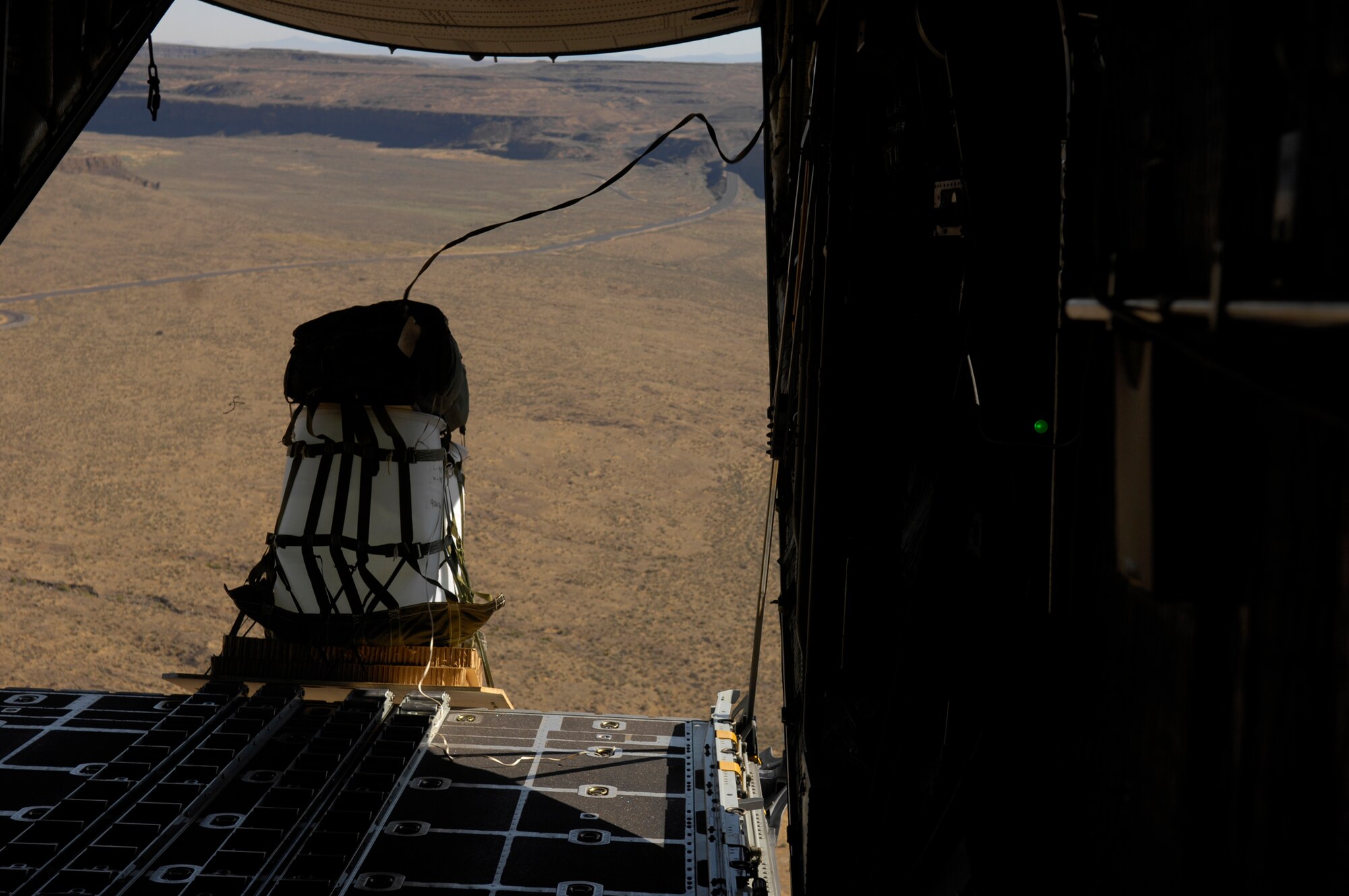 A pallet falls out of a U.S. Air Force C-130 during an air cargo drop during a flight from McChord Air Force Base, Wash., July 24, during Air Mobility Rodeo 2007. Air Mobility Command's Rodeo 2007 is a readiness competition of U.S. and international mobility air forces.  It focuses on improving war fighting capabilities and support of the Global War on Terrorism. (U.S. Air Force Photo/Senior Airman Patrick J Dixon) 


