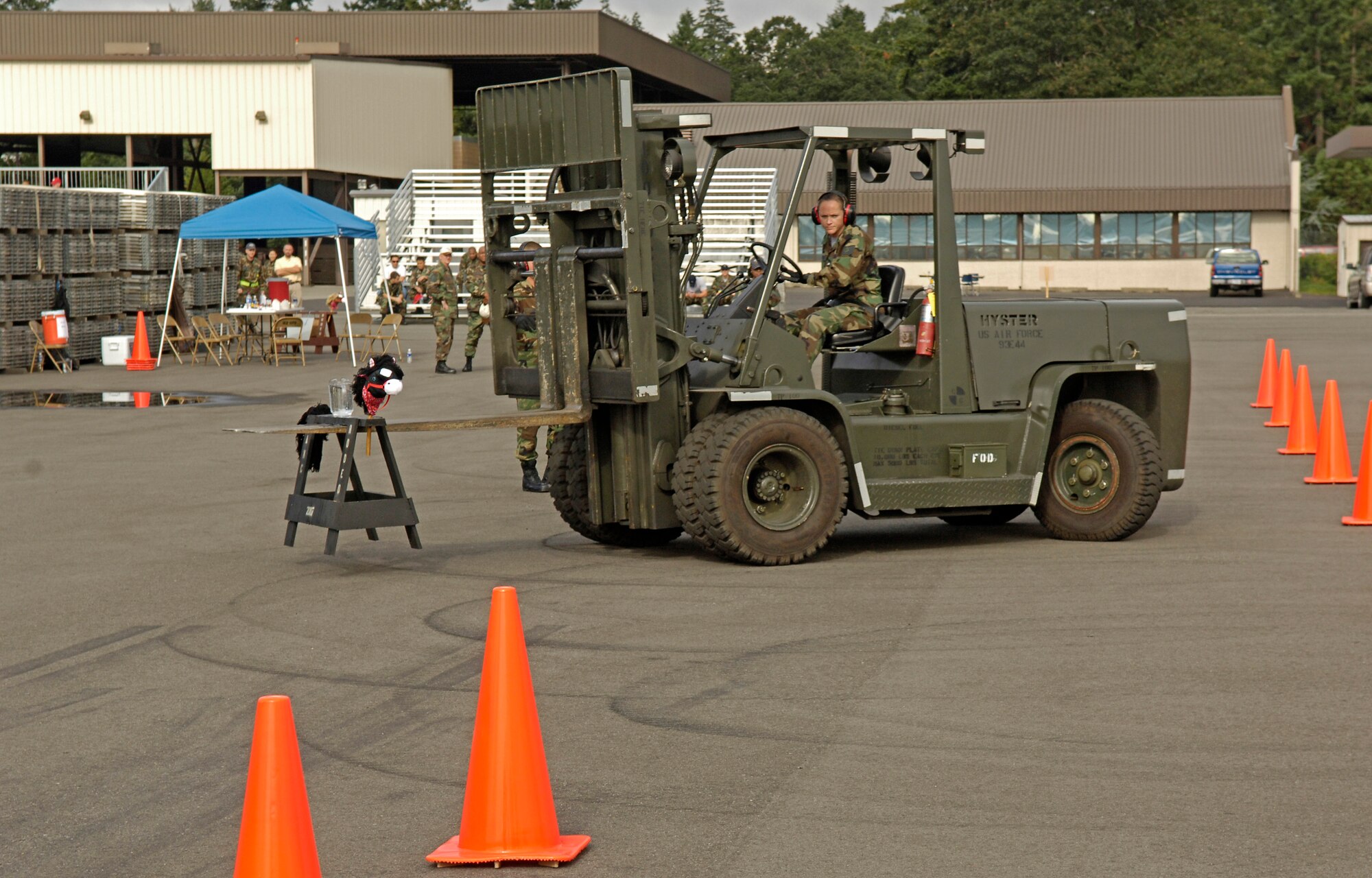 Tech. Sgt. Stephanie Norhup, 437th Aerial Port Squadron, Charleston Air Force Base, S.C.,  maneuvers through the Air Mobility Rodeo 2007 10K forklift driving course, at McChord Air Force Base, Wash., July 24.  Air Mobility Command's Rodeo 2007 is a readiness competition of U.S. and international mobility air forces.  It focuses on improving warfighting capabilities and support of the Global War on Terrorism.  (U.S. Air Force Photo/Tech. Sgt. Maria J. Bare) 