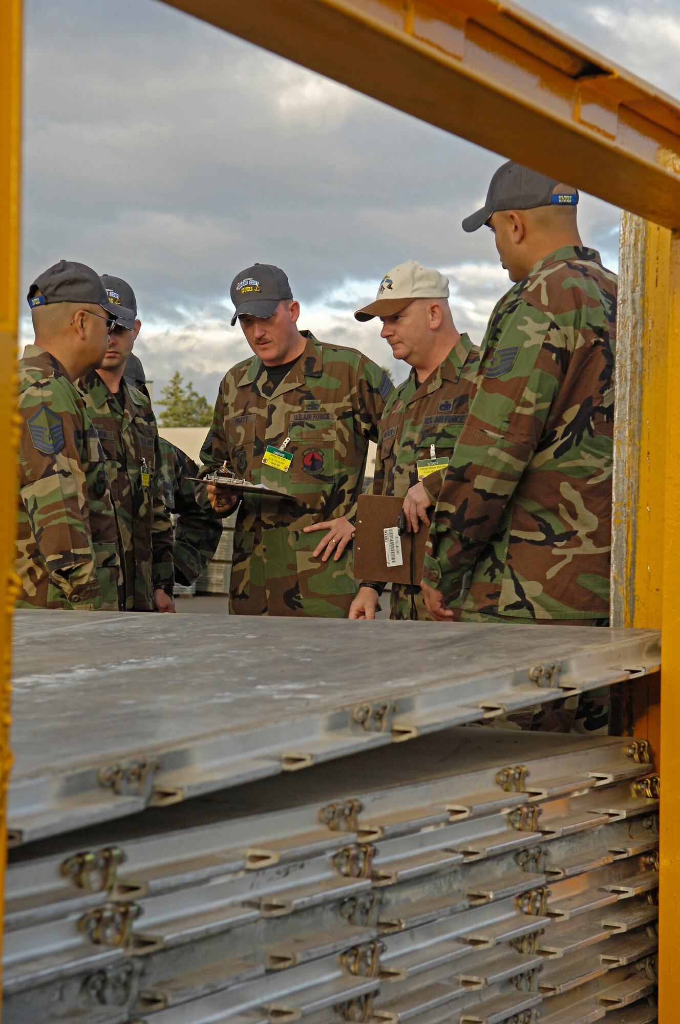 Air Mobility Rodeo 2007 umpires for the 10K forklift driving course tally the points for the 62nd Aerial Port Squadron of McChord Air Force Base, Wash., July 24 at McChord.  Air Mobility Rodeo 2007 is a readiness competition of U.S. and international mobility air forces.  It focuses on improving warfighting capabilities and support of the Global War on Terrorism.  (U.S. Air Force Photo/Tech. Sgt. Maria J. Bare) 