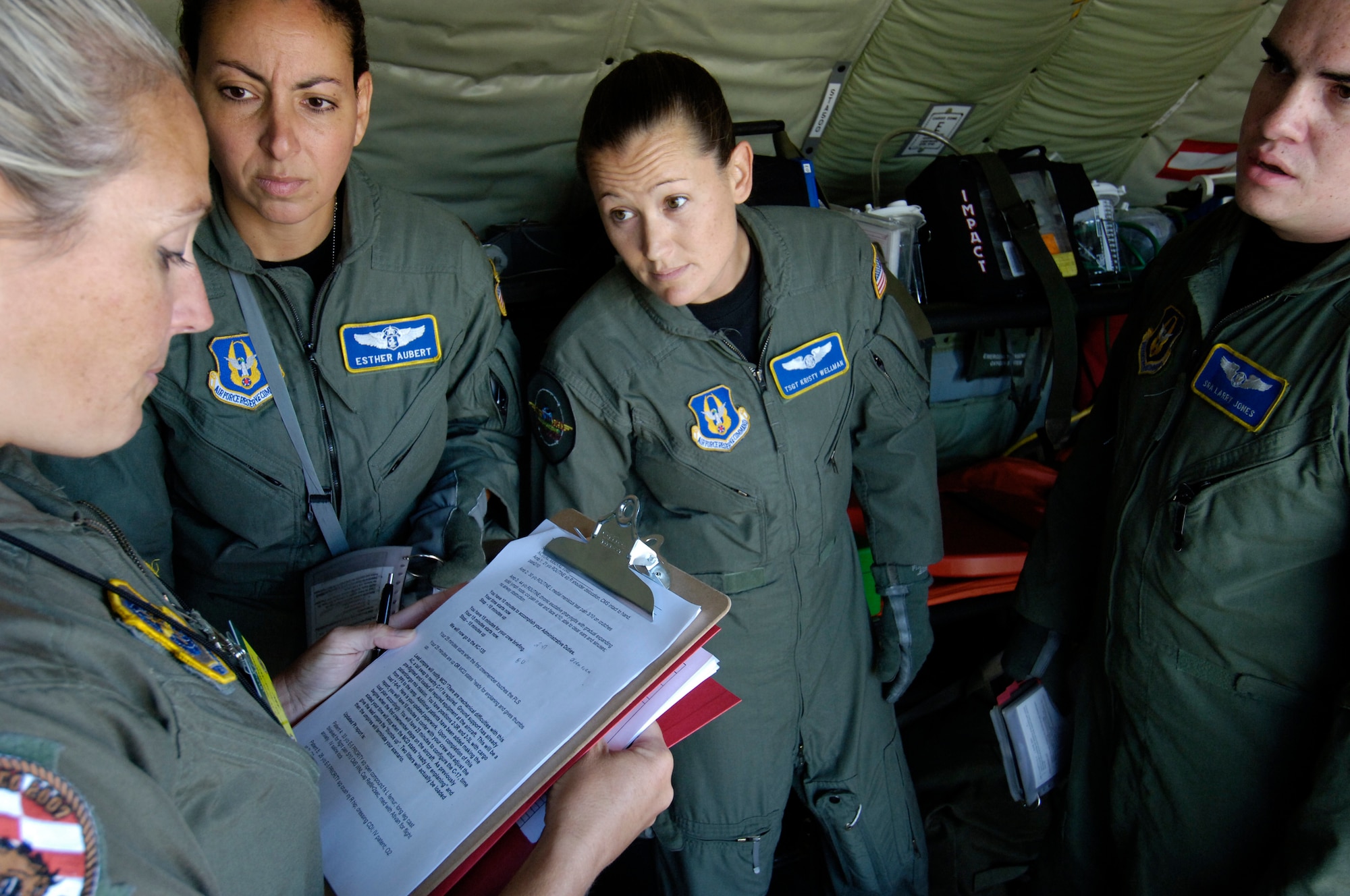 Lt. Col. Tami Rougeau discusses aeromedical evacuation procedures with competitors from the 446th Aeromedical Evacuation Squadron, McChord Air Force Base, Wash., at the aeromedical evacuation event during Air Mobility Rodeo 2007 at McChord July 24.  Air Mobility Command's Rodeo 2007 is a readiness competition of U.S. and international mobility air forces.  It focuses on improving warfighting capabilities and support of the Global War on Terrorism.  (U. S. Air Force Photo/Senior Airman Clay Lancaster) 
