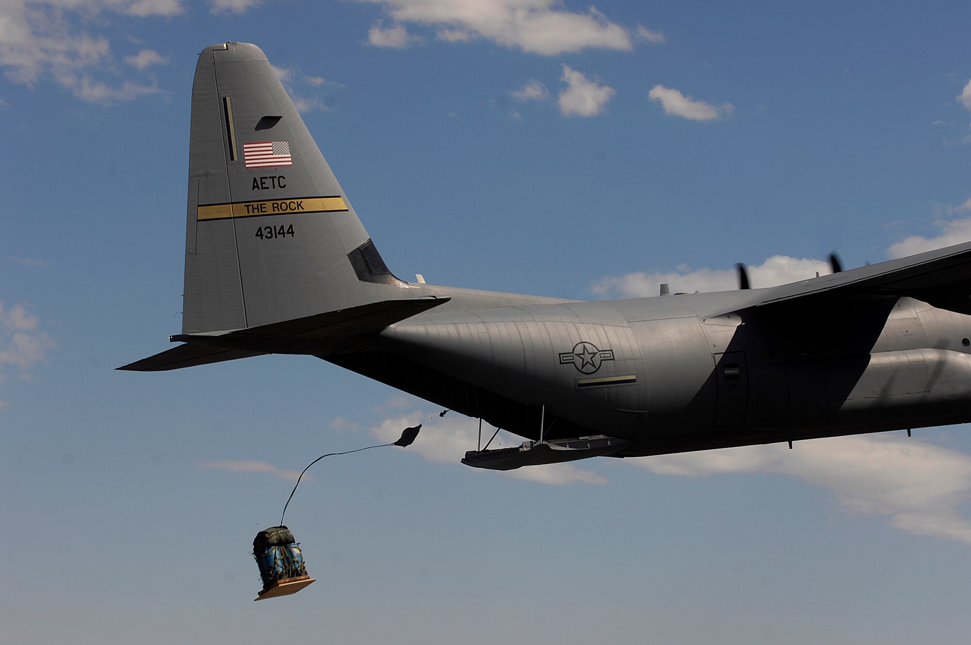 A C-130J Hercules from the 314th Airlift Wing at Little Rock Air Force Base, Ark. competes in the air drop competition for Air Mobility Rodeo 2007 by dropping pallets on targets July 23.  Air Mobility Command's Rodeo 2007 is a readiness competition of U.S. and international mobility air forces.  It focuses on improving warfighting capabilities and support of the Global War on Terrorism.  (U.S. Air Force Photo/Staff Sgt. Richard Rose) 

