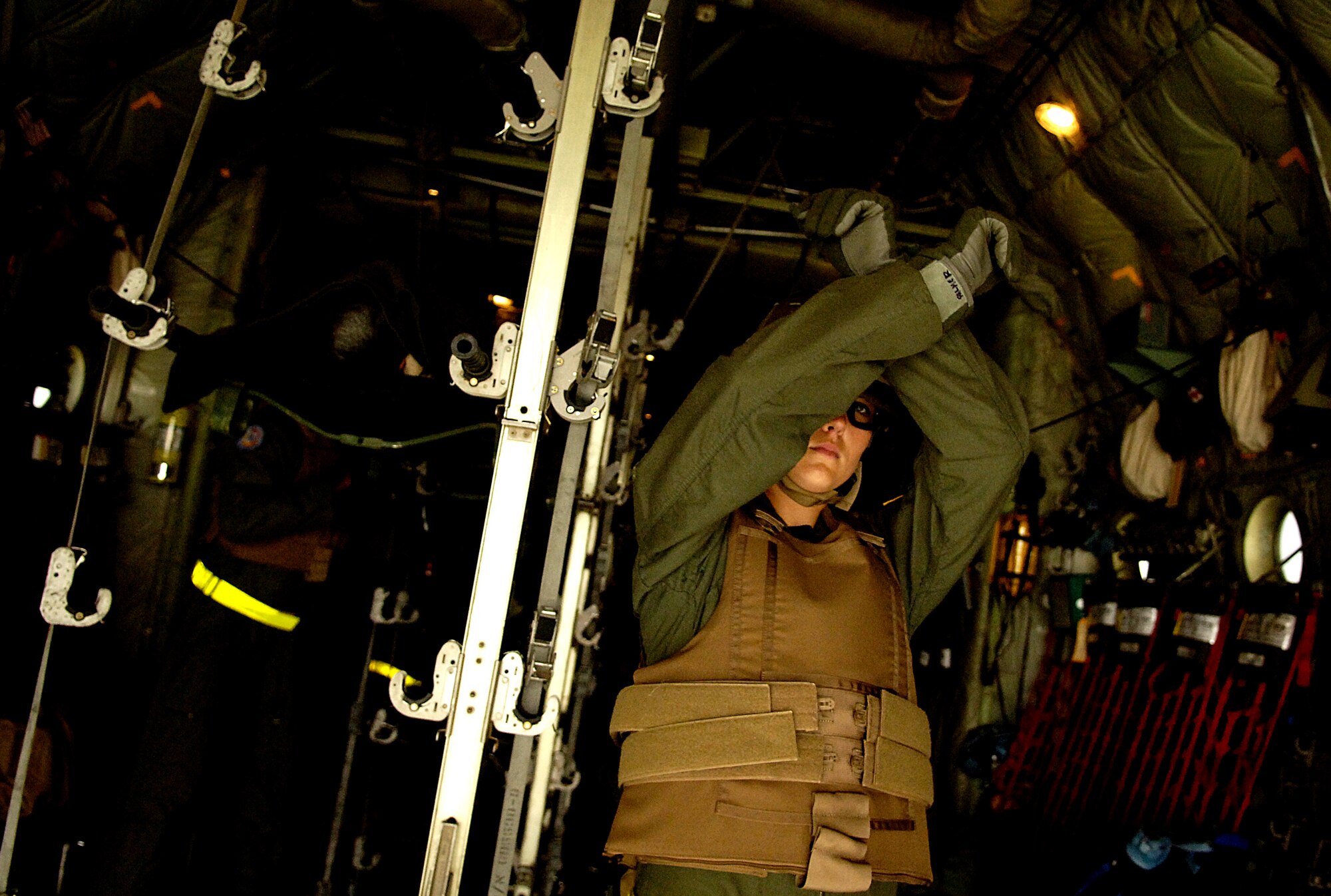 Capt. Lisa Palmer directs her team as they load mock patients aboard a C-130 Hercules for the aeromedical evacuation competition July 23 during Air Mobility Command's Rodeo 2007 at McChord Air Force Base, Wash. Rodeo 2007 is a readiness competition of U.S. and international mobility air forces. Captain Palmer is the medical crew director and is assigned to the 375th Aeromedical Evacuation Squadron at Scott AFB, Ill. (U.S. Air Force photo/Tech. Sgt. Jeremy T. Lock)
