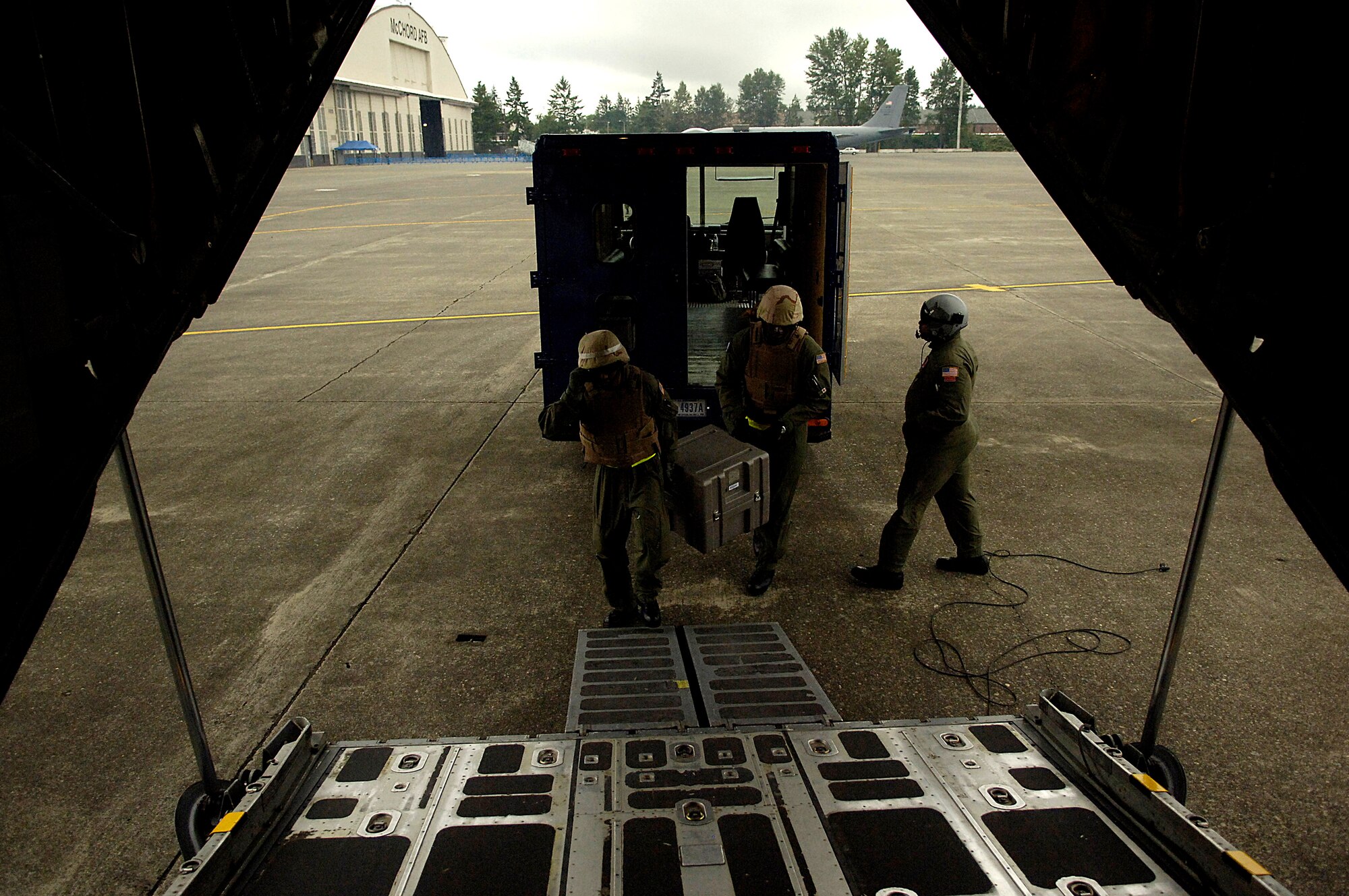 Tech. Sgt. Kermit McLauchin and Tech. Sgt. Ricardo Brown load medical supplies on a C-130 Hercules for a aeromedical evacuation competition July 23 during Air Mobility Command's Rodeo 2007 at McChord Air Force Base, Wash. Rodeo 2007 is a readiness competition of U.S. and international mobility air forces. The NCOs are medical technicians assigned to the from the 375th Aeromedical Evacuation Squadron at Scott AFB, Ill. (U.S. Air Force photo/Tech. Sgt. Jeremy T. Lock)
