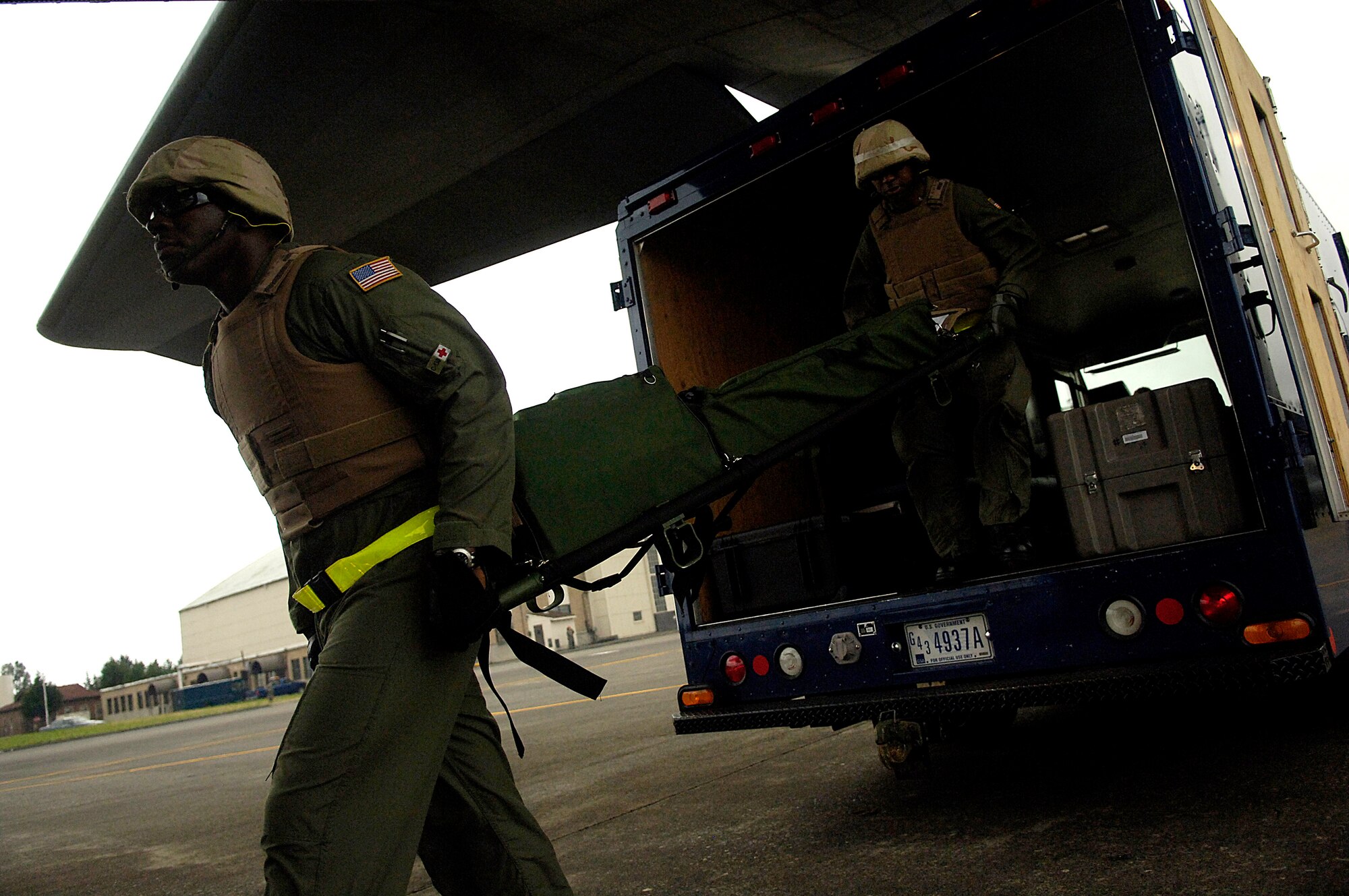 Tech. Sgt. Kermit McLauchin and Tech. Sgt. Ricardo Brown load medical supplies on a C-130 Hercules for a aeromedical evacuation competition July 23 during Air Mobility Command's Rodeo 2007 at McChord Air Force Base, Wash. Rodeo 2007 is a readiness competition of U.S. and international mobility air forces. The NCOs are medical technicians assigned to the from the 375th Aeromedical Evacuation Squadron at Scott AFB, Ill. (U.S. Air Force photo/Tech. Sgt. Jeremy T. Lock)
