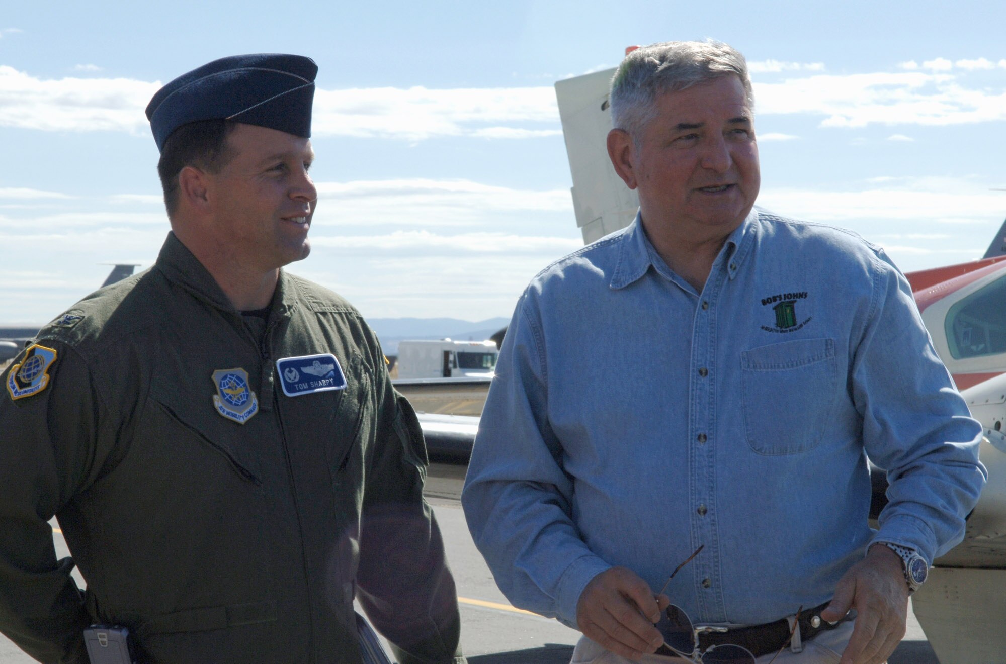 Col. Thomas Sharpy greets retired Gen. Ronald R. Fogleman, the former Air Force chief of staff, upon his arrival July 24 to Fairchild Air Force Base, Wash. The general spoke to Airmen during the 92nd Air Refueling Wing's 60th Anniversary Speakers Symposium, a monthly base event celebrating the Air Force anniversary. The general and his wife, Miss Jane, also visited various base organizations and people before leaving July 25. Colonel Sharpy is the 92nd Air Refueling Wing commander. (U.S. Air Force photo/Airman 1st Class Jocelyn Ford) 
