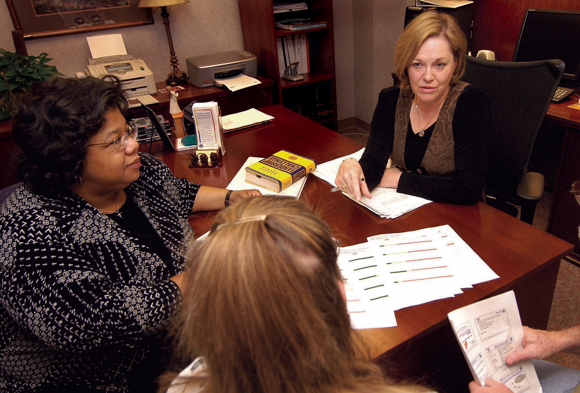 Valerie Biltz, director, right, and Wynell Neece, PhD. of the Organizational Consulting office, study the morale of an organization through assessments, surveys and consulting with different levels of personnel. Keeping morale and production high is a goal of the office, which opened in 2003. (Air Force photo by Margo Wright)