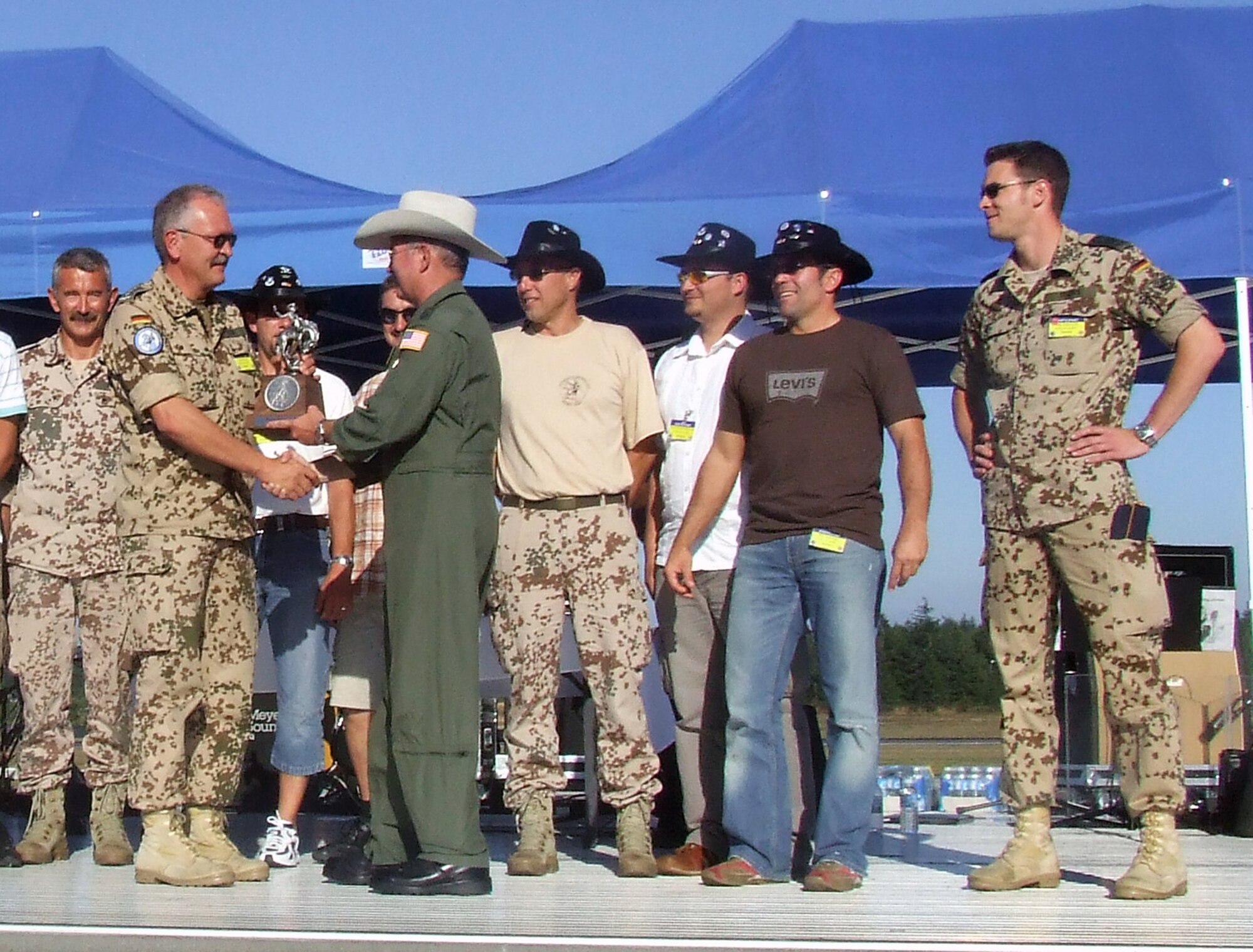 Gen. Duncan McNabb, Air Mobility Command commander, presents the Best C-130 Preflight Team Award to the team from German Transport Wing 61, Germany, during an awards presentation for Air Mobility Rodeo 2007 at McChord Air Force Base, Wash., July 25.  The Germans were one of 11 recipients of more than 60 awards that will be presented during the competition.  Rodeo, sponsored by Air Mobility Command, is a readiness competition for U.S. and international mobility air forces.  (U.S. Air Force Photo/Tech. Sgt. Scott T. Sturkol) 