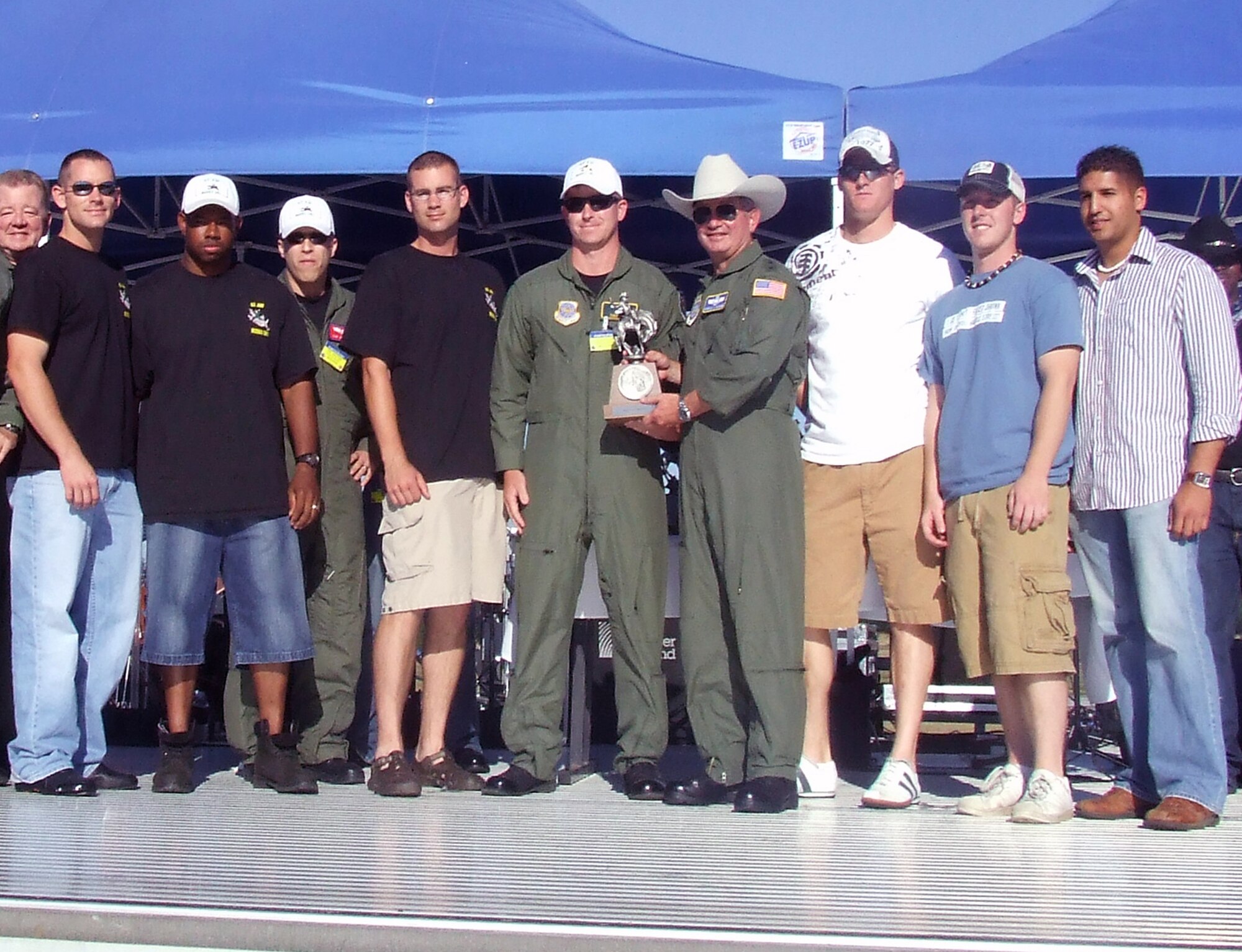 Gen. Duncan McNabb, Air Mobility Command commander, presents the Best Fit-To-Fight Team to the 62nd Airlift Wing, McChord Air Force Base, Wash., during an awards presentation for Air Mobility Rodeo 2007 at McChord Air Force Base, Wash., July 25.  The 62nd team were one of 11 recipients of more than 60 awards that will be presented during the competition.  Rodeo, sponsored by Air Mobility Command, is a readiness competition for U.S. and international mobility air forces.  (U.S. Air Force Photo/Tech. Sgt. Scott T. Sturkol) 