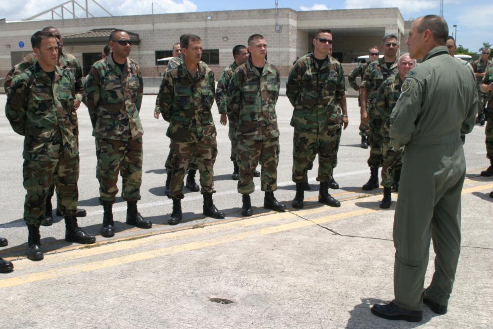 Col. Randy Falcon (right), 482nd Fighter Wing commander, thanks some of the Maintenance Group Airmen who went ‘above and beyond’ in refurbishing the flagship of the 482nd Fighter Wing, aircraft # 290. 482nd Maintenance Group Airmen presented the commander with a pristine jet after a flawless repainting and meticulous cleaning here July 15. Each Air Force wing commander is authorized an aircraft designated as the flagship, or commander’s plane. (U.S. Air Force photo/Tech. Sgt. Paul Dean)