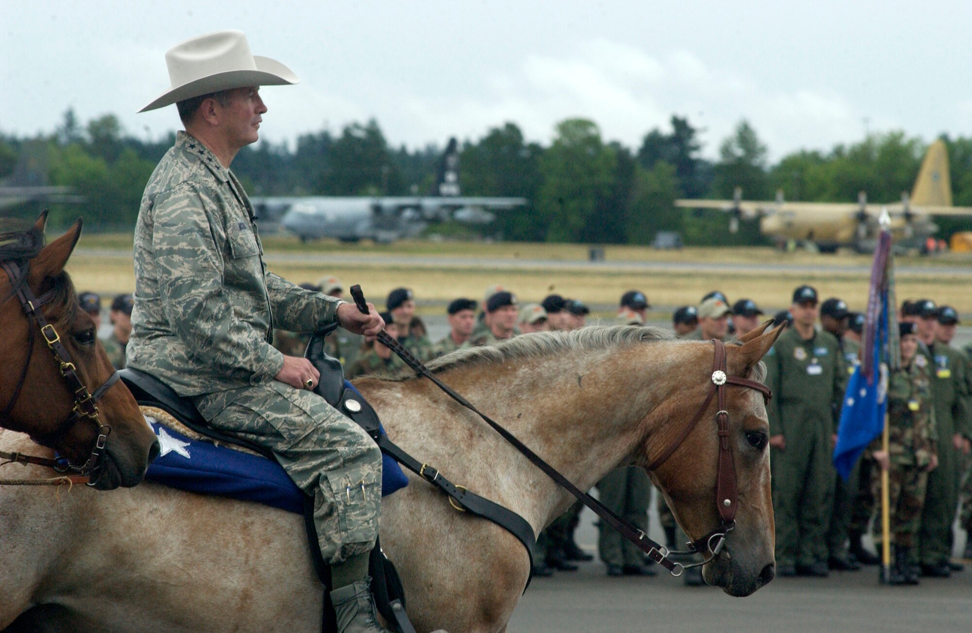 Gen. Duncan J. McNabb rides into the Air Mobility Command Rodeo 2007 opening ceremony July 22 at McChord Air Force Base, Wash. Rodeo 2007 is an international mobility air forces readiness competition designed to improve technical abilities through approximately 25 evaluated events on the ground and in the air. General McNabb is the AMC commander. (U.S. Air Force photo/Michael Tolzmann)
