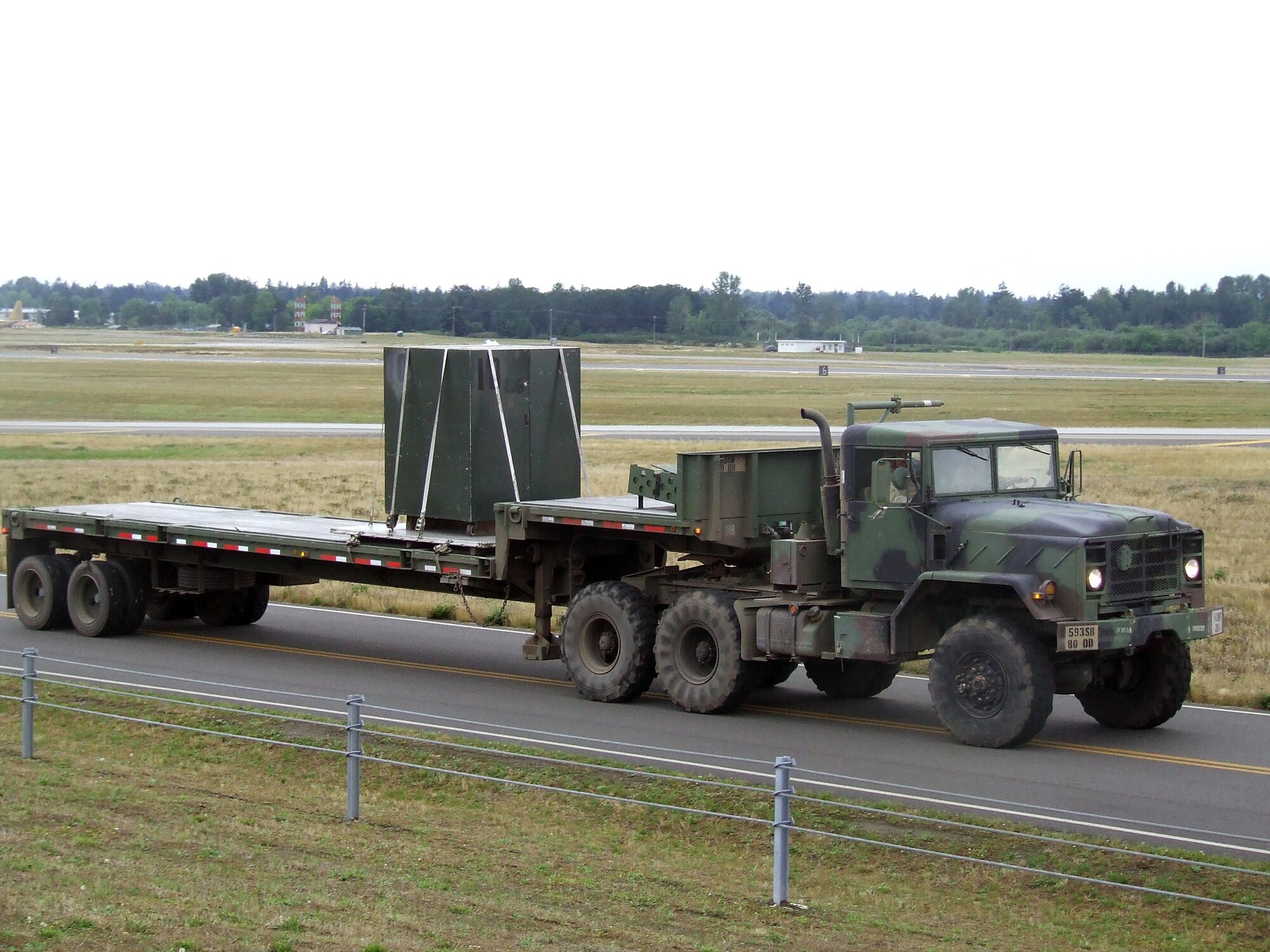 Security forces Airmen from the 62nd Security Forces Squadron conduct a convoy demonstration for Air Mobility Rodeo 2007 teams and observers July 22 at McChord Air Force Base, Wash.  Rodeo, sponsored by Air Mobility Command, is a readiness competition for U.S. and international mobility air forces.  (U.S. Air Force Photo/Tech. Sgt. Scott T. Sturkol)