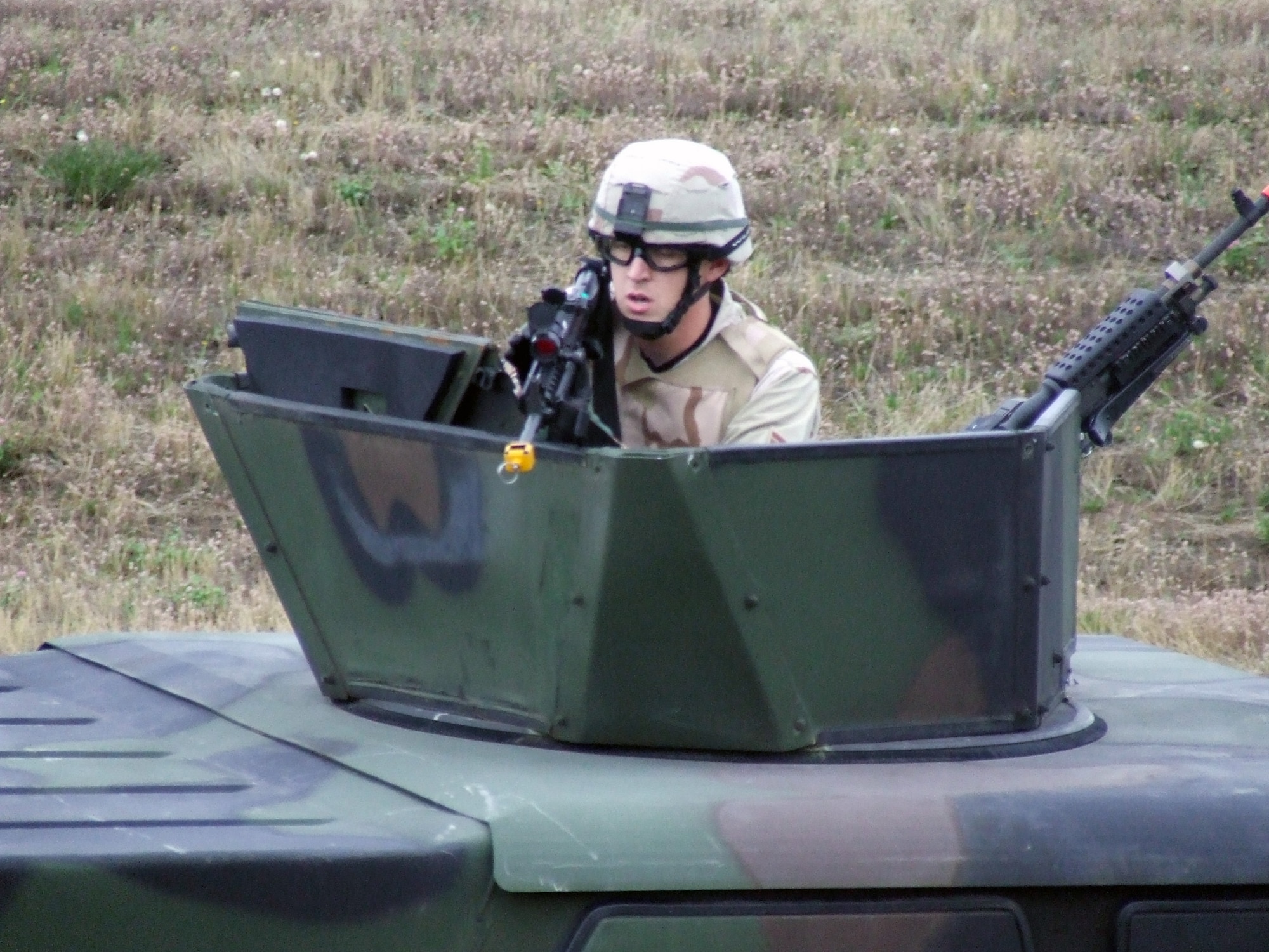 A security forces Airman from the 62nd Security Forces Squadron participates in a convoy demonstration for Air Mobility Rodeo 2007 teams and observers July 22 at McChord Air Force Base, Wash.  Rodeo, sponsored by Air Mobility Command, is a readiness competition for U.S. and international mobility air forces.  (U.S. Air Force Photo/Tech. Sgt. Scott T. Sturkol)