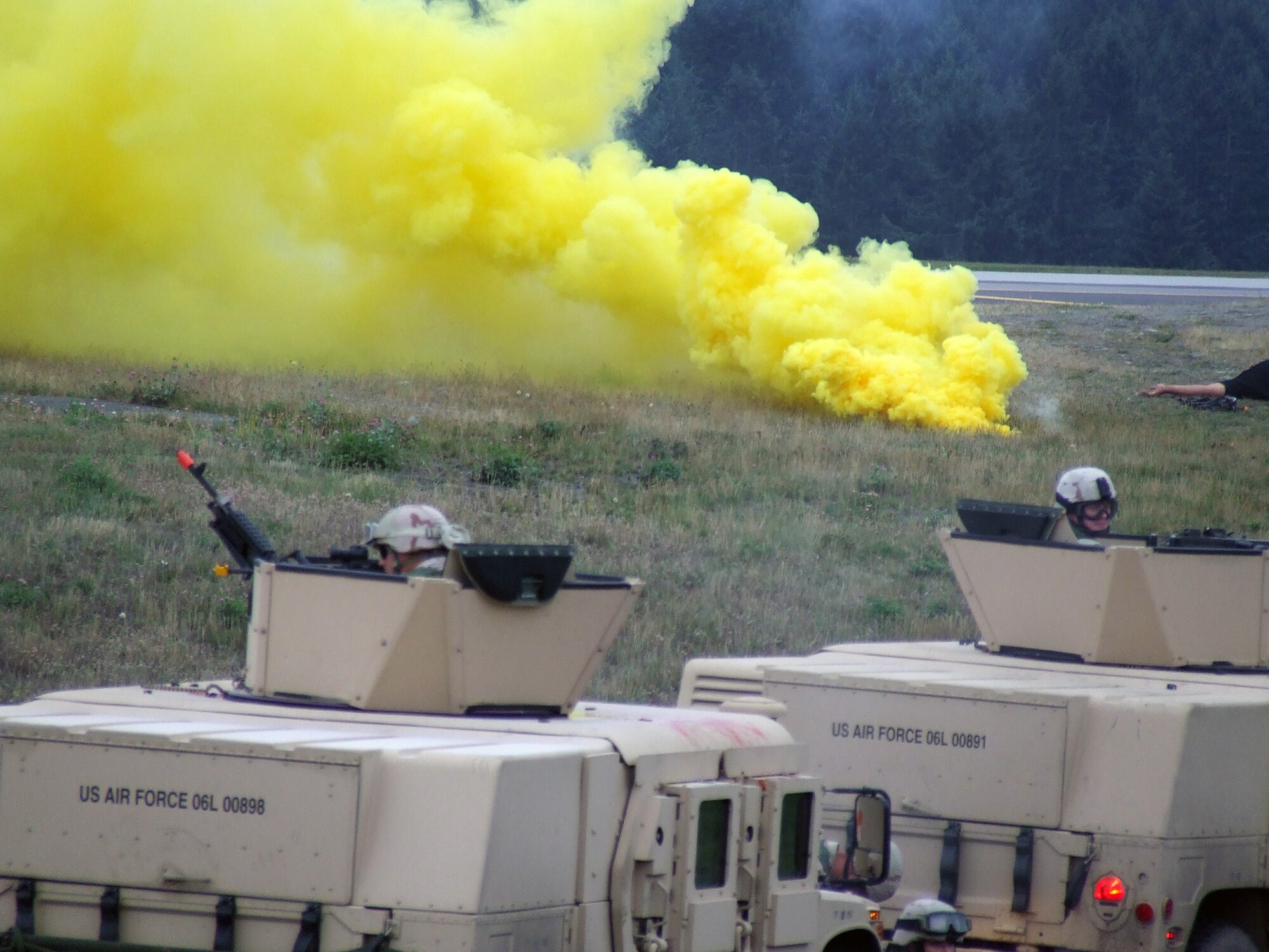 Security forces Airmen from the 62nd Security Forces Squadron participate in a convoy demonstration for Air Mobility Rodeo 2007 teams and observers July 22 at McChord Air Force Base, Wash.  Rodeo, sponsored by Air Mobility Command, is a readiness competition for U.S. and international mobility air forces.  (U.S. Air Force Photo/Tech. Sgt. Scott T. Sturkol)