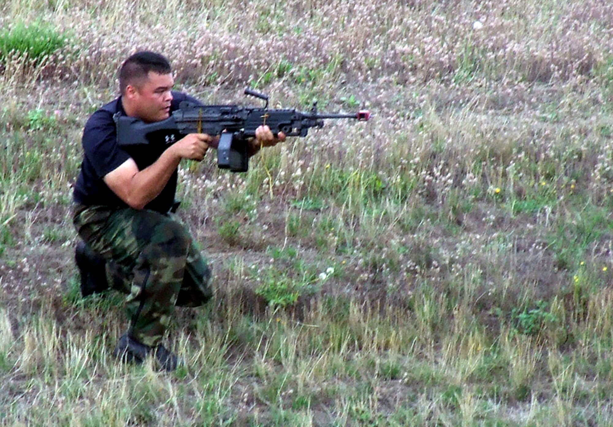 A security forces Airman from the 62nd Security Forces Squadron plays an "opposing forces" member as part of a convoy demonstration for Air Mobility Rodeo 2007 teams and observers July 22 at McChord Air Force Base, Wash.  Rodeo, sponsored by Air Mobility Command, is a readiness competition for U.S. and international mobility air forces.  (U.S. Air Force Photo/Tech. Sgt. Scott T. Sturkol)