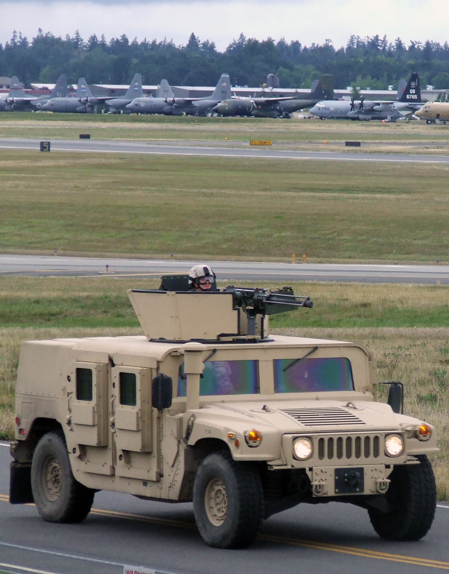 Security forces Airmen from the 62nd Security Forces Squadron begin a convoy demonstration for Air Mobility Rodeo 2007 teams and observers July 22 at McChord Air Force Base, Wash.  Rodeo, sponsored by Air Mobility Command, is a readiness competition for U.S. and international mobility air forces.  (U.S. Air Force Photo/Tech. Sgt. Scott T. Sturkol)