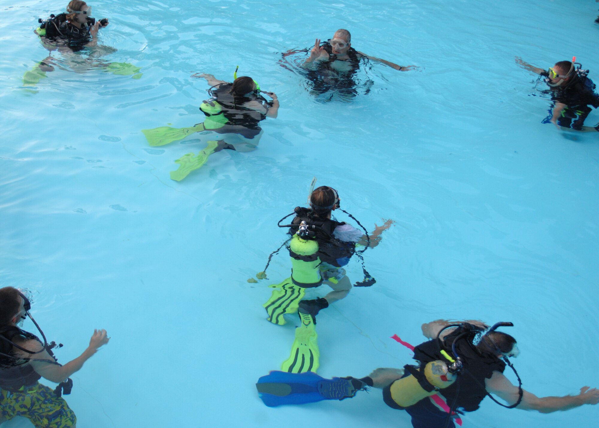 SEYMOUR JOHNSON AIR FORCE BASE, N.C. - Participants in the open water SCUBA ceritfication course prepare to make their first dive, July 25. During the 7-day course participants learn fundamentals of scuba diving, including dive equipment and techniques. (U.S. Air Force photo by Airman 1st Class Greg Biondo)