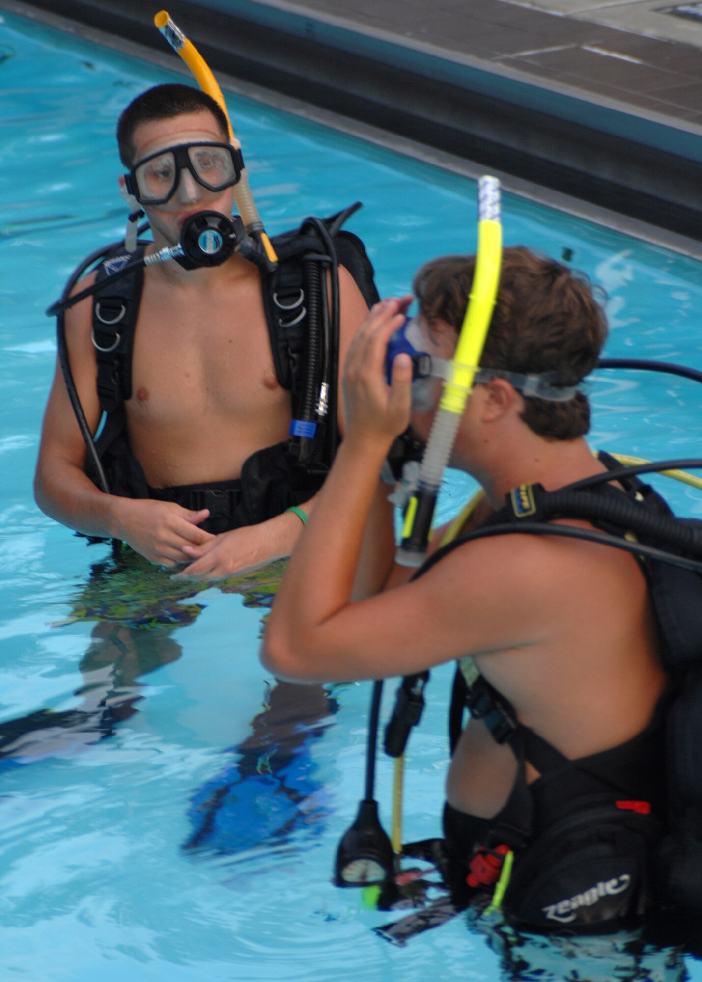 SEYMOUR JOHNSON AIR FORCE BASE, N.C. - Participants in the open water SCUBA ceritfication course prepare to make their first dive, July 25. During the 7-day course participants learn fundamentals of scuba diving, including dive equipment and techniques. (U.S. Air Force photo by Airman 1st Class Greg Biondo)