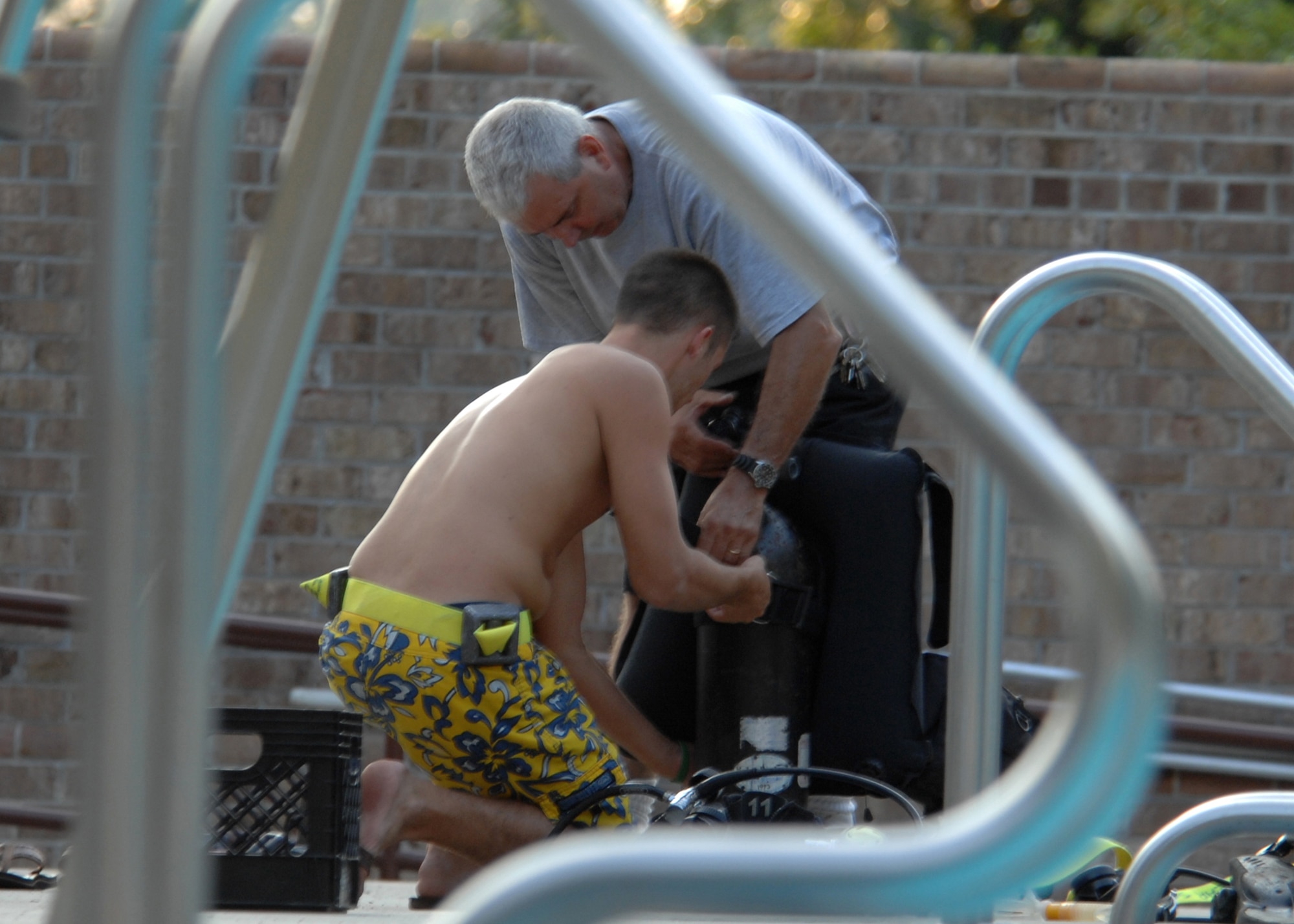 SEYMOUR JOHNSON AIR FORCE BASE, N.C. - Participants in the open water SCUBA ceritfication course prepare to make their first dive, July 25. During the 7-day course participants learn fundamentals of scuba diving, including dive equipment and techniques. (U.S. Air Force photo by Airman 1st Class Greg Biondo)