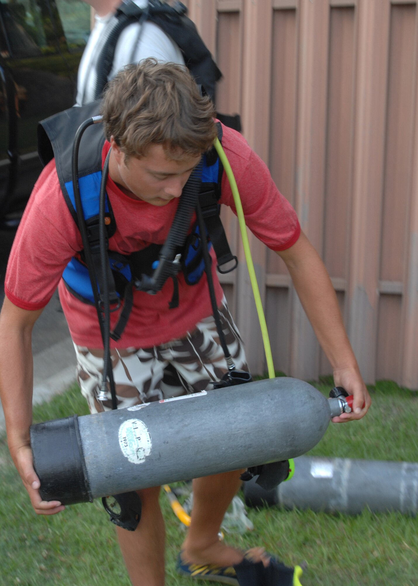 SEYMOUR JOHNSON AIR FORCE BASE, N.C. - A student participating in the open water SCUBA ceritfication course gathers his equipment, July 25. During the 7-day course participants learn fundamentals of scuba diving, including dive equipment and techniques. (U.S. Air Force photo by Airman 1st Class Greg Biondo)