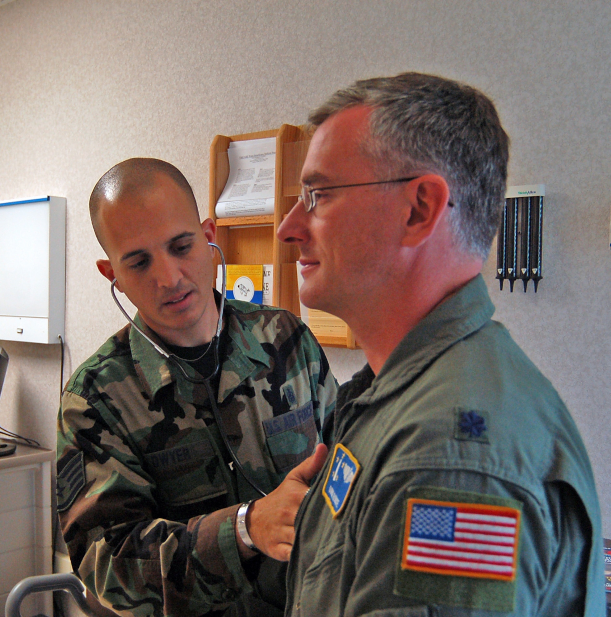 Staff Sgt. Christopher Dwyer, 436th Aeromedical Dental Operations Squadron independent duty medical technician, performs a physical assessment of Lt. Col. Doug Rouse, 436th ADOS flight surgeon. (U.S. Air Force photo/Tech. Sgt. Kevin Wallace)