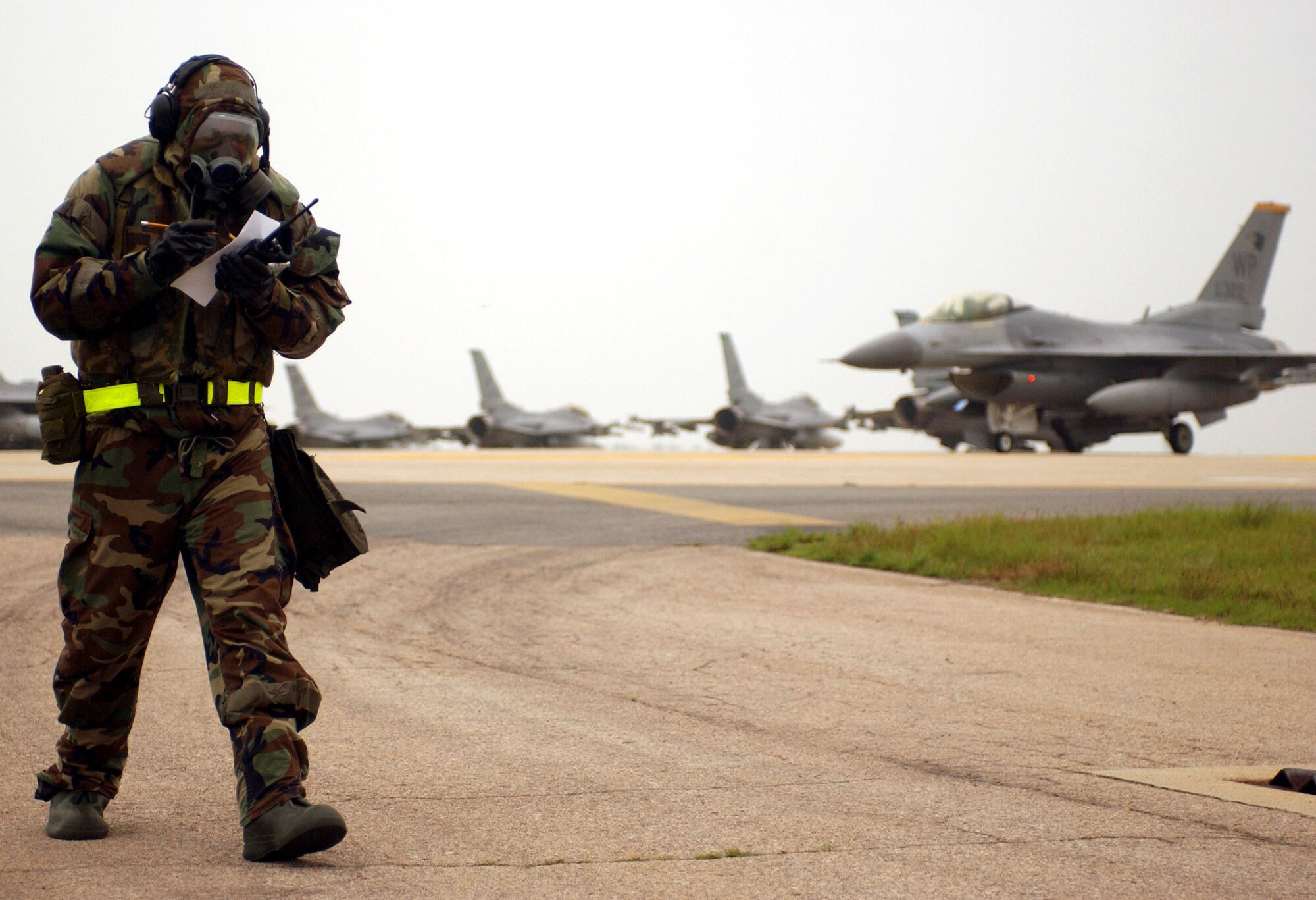 Staff Sgt. Corey Jones reviews his checklist during the Peninsula-Wide Combat Employment Response Exercise July 26 at Kunsan Air Base, South Korea. Members of the 8th Fighter Wing are conducting the quarterly exercise to test it's ability to maintain a credible deterrence on the Korean peninsula. Sergeant Jones is assigned to the 8th Maintenance Squadron. (U.S. Air Force photo/Senior Airman Steven R. Doty) 
