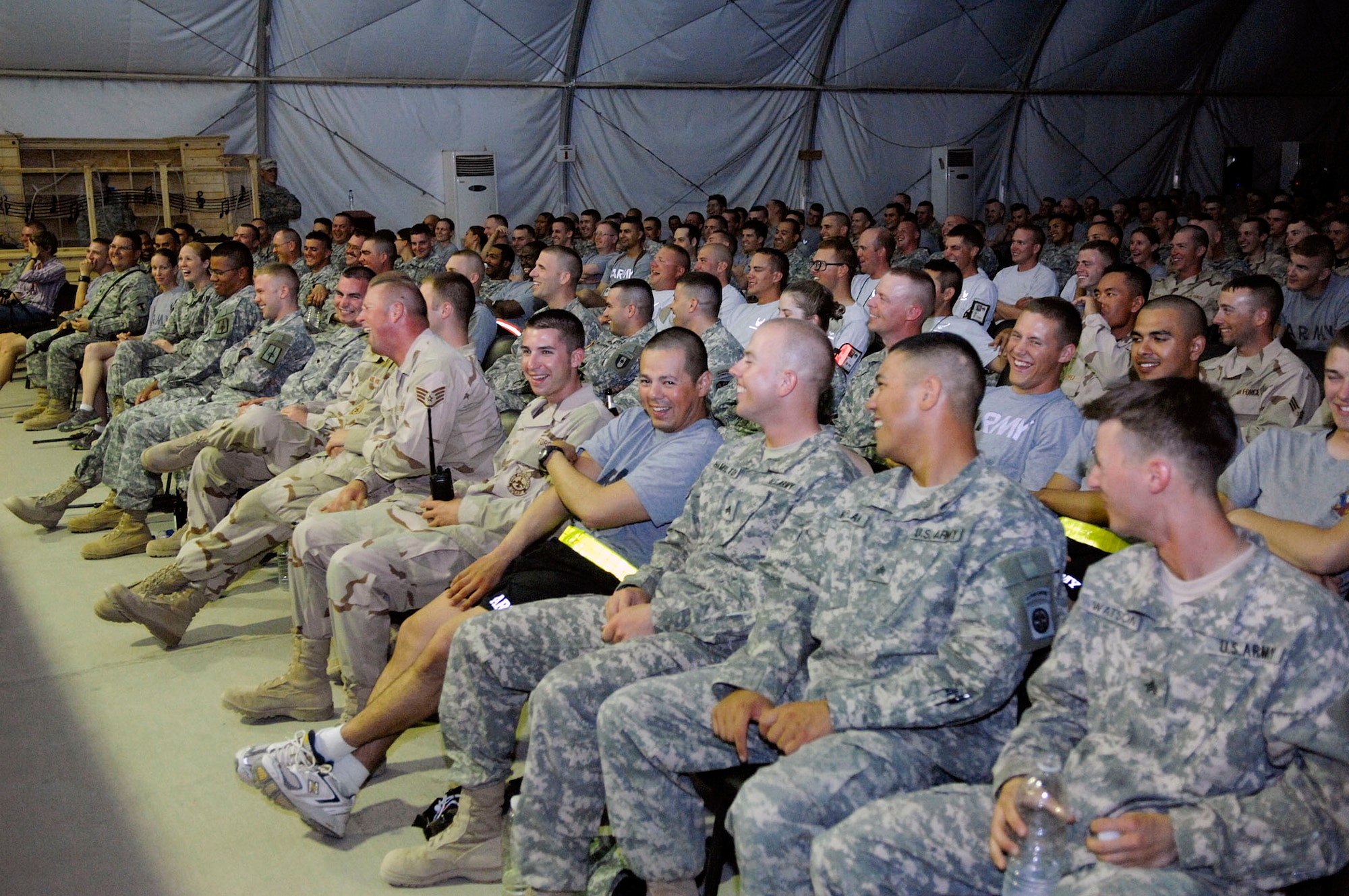 More than 700 Soldiers and Airman enjoy Scott Kennedy's comedy routine during a USO show at Camp Adder, Iraq. He is touring with Dave Attell of Comedy Central's "Insomniac with Dave Attell." Camp Adder was the second of eight stops in theater. (U.S. Air Force photo/Master Sgt. Robert W. Valenca) 
