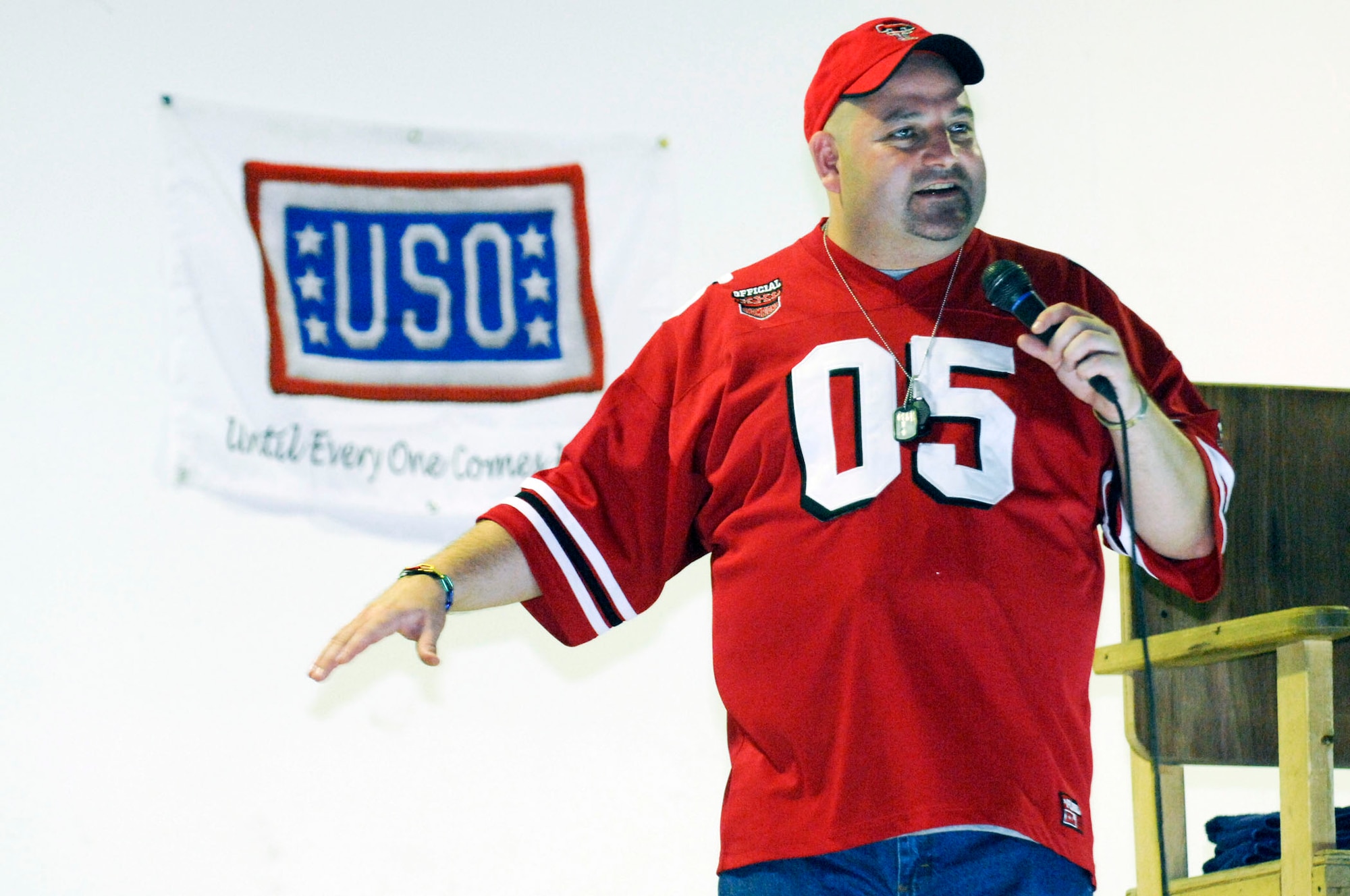 Scott Kennedy performs his comedy routine for more than 700 Airmen and Soldiers at a USO show July 25 at Camp Adder, Iraq. This is Mr. Kennedy's fifth USO tour in the region. He is touring with Dave Attell of Comedy Central's "Insomniac with Dave Attell." Camp Adder was the second of eight stops in theater. (U.S. Air Force photo/Master Sgt. Robert W. Valenca)
