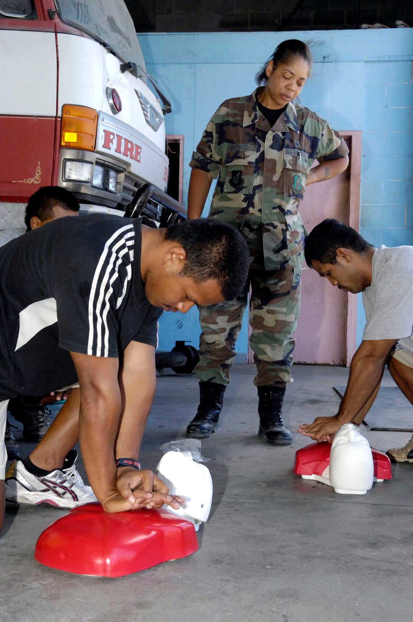 Tech. Sgt. Michelle Bligen-Cox teaches CPR to a firefighter July 25 in the Republic of Nauru. Sergeant Bligen-Cox is part of a 12-person, joint-force U.S. Pacific Command team sent to provide assitance and training to caregivers and first responders on the small South Pacific island. She is assigned to the 35th Medical Group at Misawa Air Base, Japan. (U.S. Air Force photo/Tech. Sgt. Chris Vadnais)
