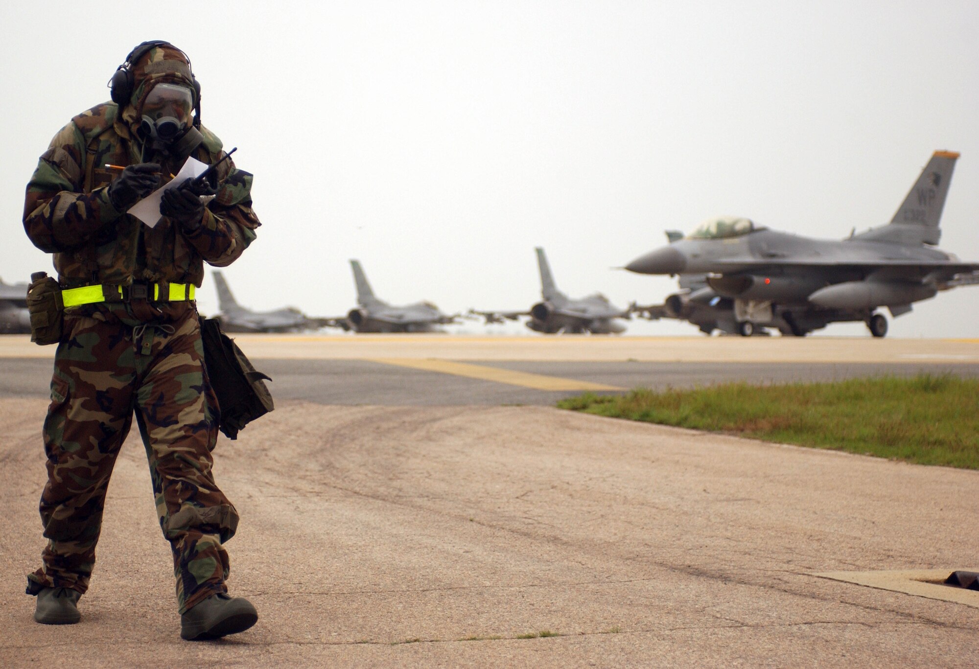 KUNSAN AIR BASE, Republic of Korea -- Staff Sgt. Corey Jones, 8th Maintenance Squadron, reviews over his checklist during the Peninsula-Wide Combat Employment Response Exercise July 26. The 8th Fighter Wing "Wolf Pack" is currently conducting the quarterly exercise to test it's ability to maintain a credible deterrence on the Korean peninsula. (U.S. Air Force photo/Senior Airman Steven R. Doty)                                