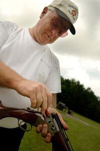 Mr.Clark loads his shotgun for skeet shooting.  (U.S. Air Force photo/Airman 1st Class Nicholas Pilch) 
