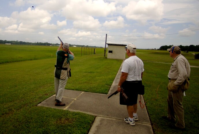 Ret. Army Col. Jim Coggins fires at a clay pigeon while Al Clark and Bob Middaugh, his teammates, wait for their turn during a skeet shooting game at the Skeet and Trap range.  (U.S. Air Force photo/Airman 1st Class Nicholas Pilch) 
