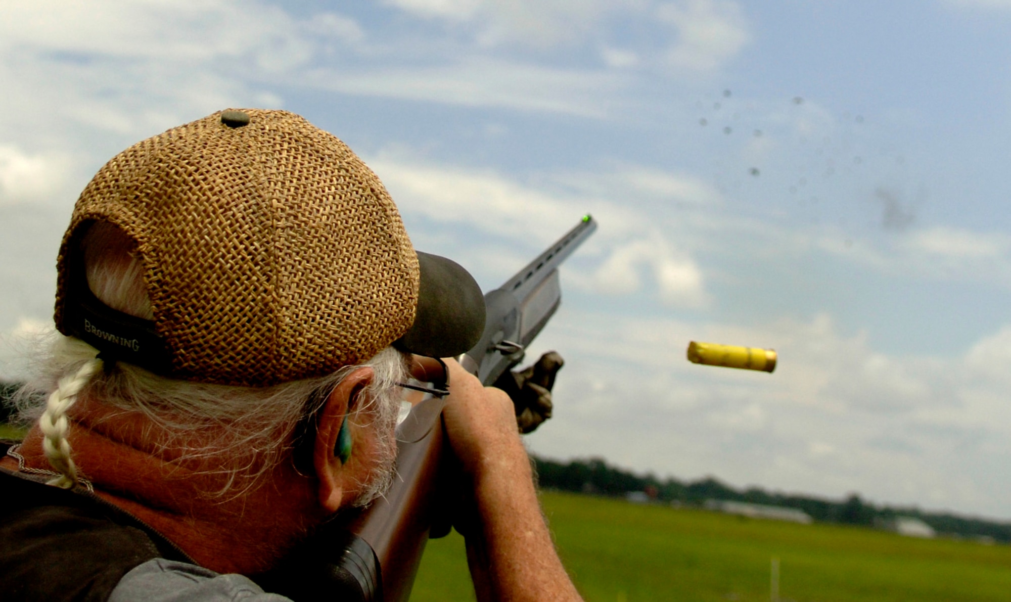 Retired NBC art director Jim Nicholson fires at a clay pigeon during a skeet shooting game at the Charleston AFB's Skeet and Trap Range Wednesday.  (U.S. Air Force photo/Airman 1st Class Nicholas Pilch) 

